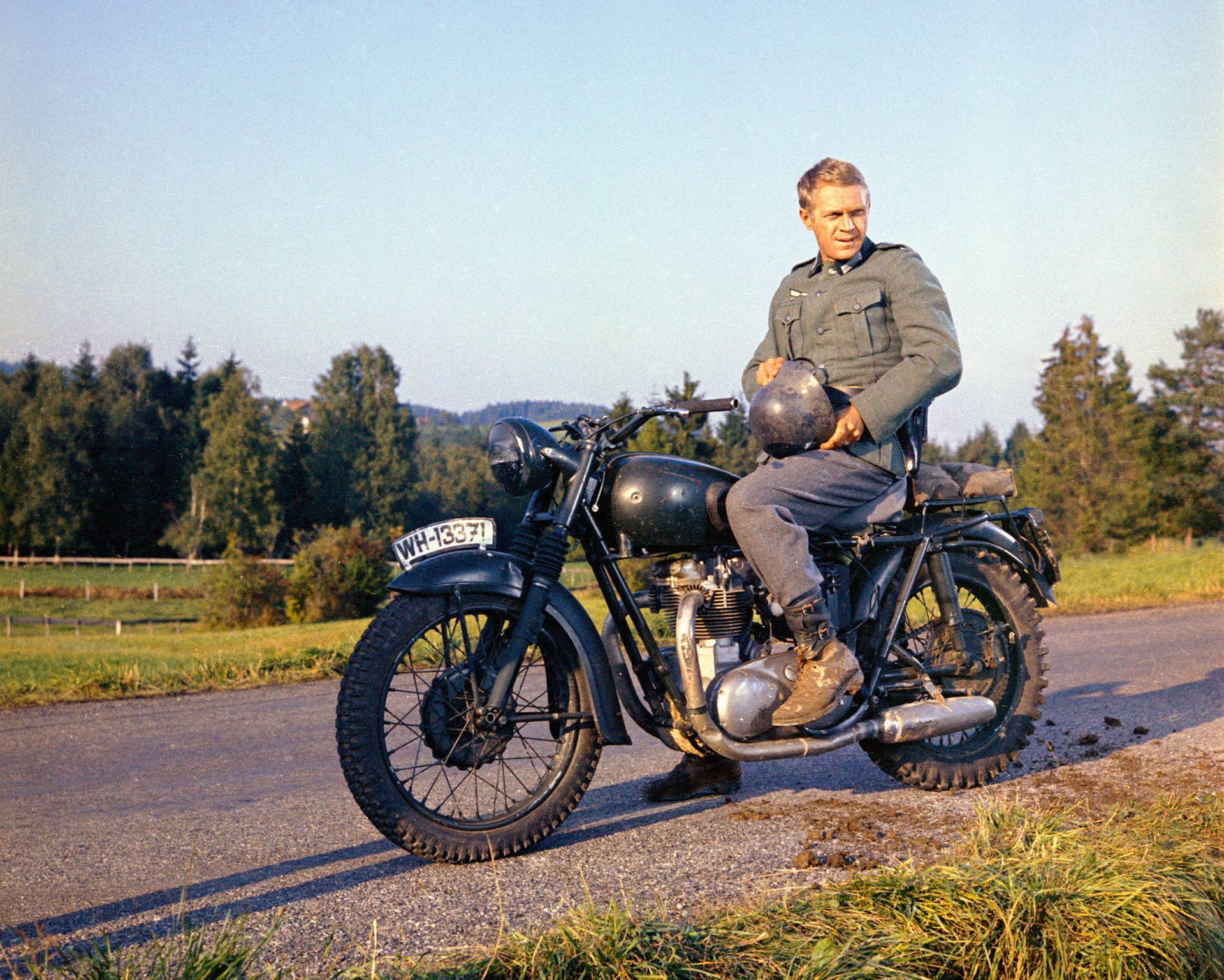 Steve McQueen (1930-1980), US actor, wearing a German military uniform, sitting astride a motorcycle in a publicity still issued for the film, 'The Great Escape', 1963. The prisoner of war drama, directed by John Sturges (1910-1992), starred McQueen as 'Captain Virgil 'The Cooler King' Hilts'. (Photo by Silver Screen Collection/Getty Images)