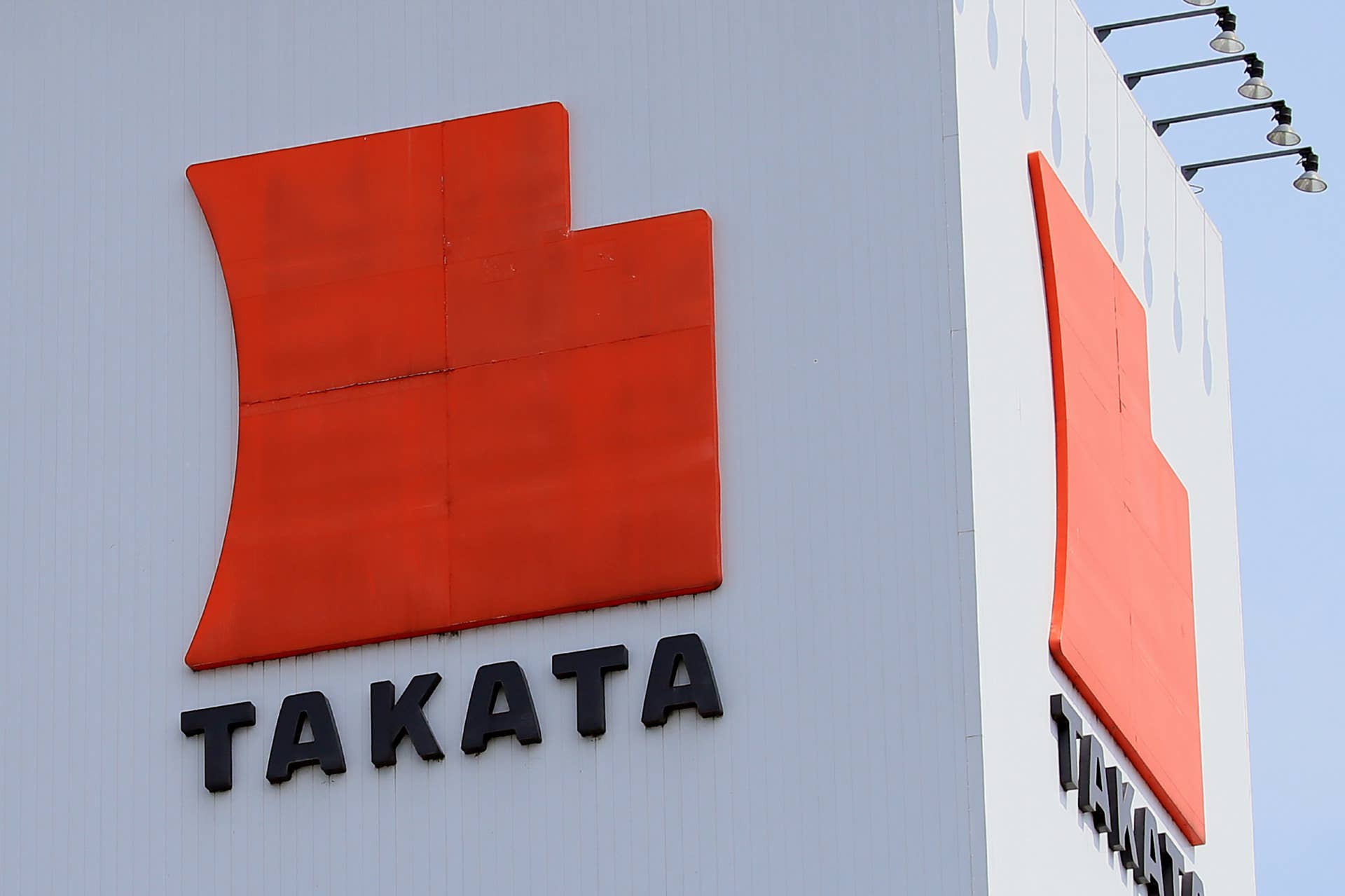 This photo taken on June 24, 2017 shows the Takata logo displayed on the top of the Takata factory at Aisho, Shiga prefecture. Takata executives faced angry investors on June 27 after the company at the centre of the world's biggest auto safety recall filed for bankruptcy and said it was being bought by a US company. / AFP PHOTO / JIJI PRESS / STR / Japan OUT (Photo credit should read STR/AFP/Getty Images)