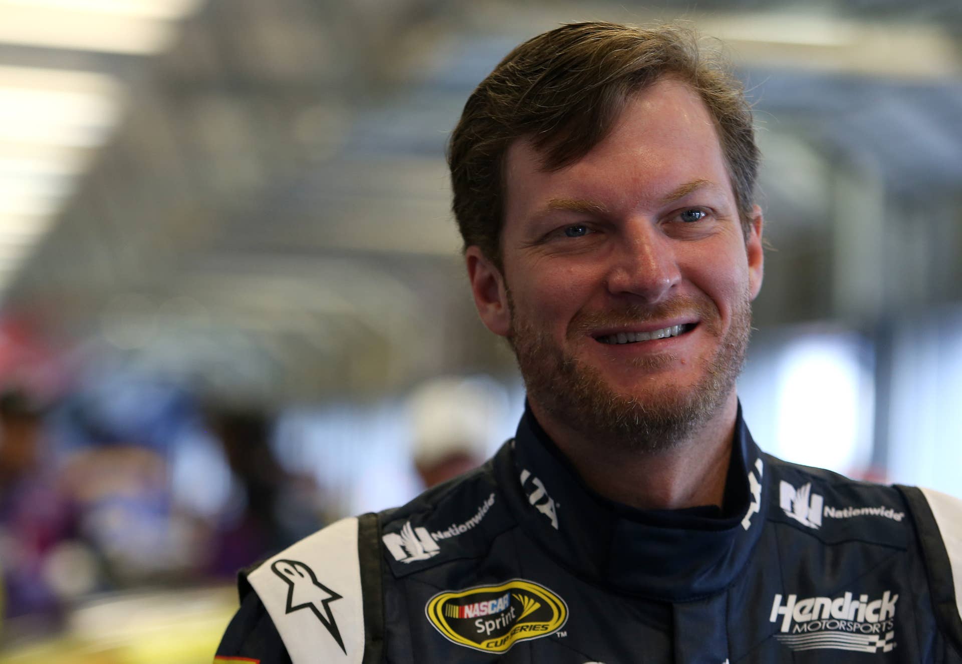 SPARTA, KY - JULY 08: Dale Earnhardt Jr., driver of the #88 Nationwide Chevrolet, stands in the garage area during practice for the NASCAR Sprint Cup Series Quaker State 400 at Kentucky Speedway on July 8, 2016 in Sparta, Kentucky. (Photo by Matt Hazlett/Getty Images)