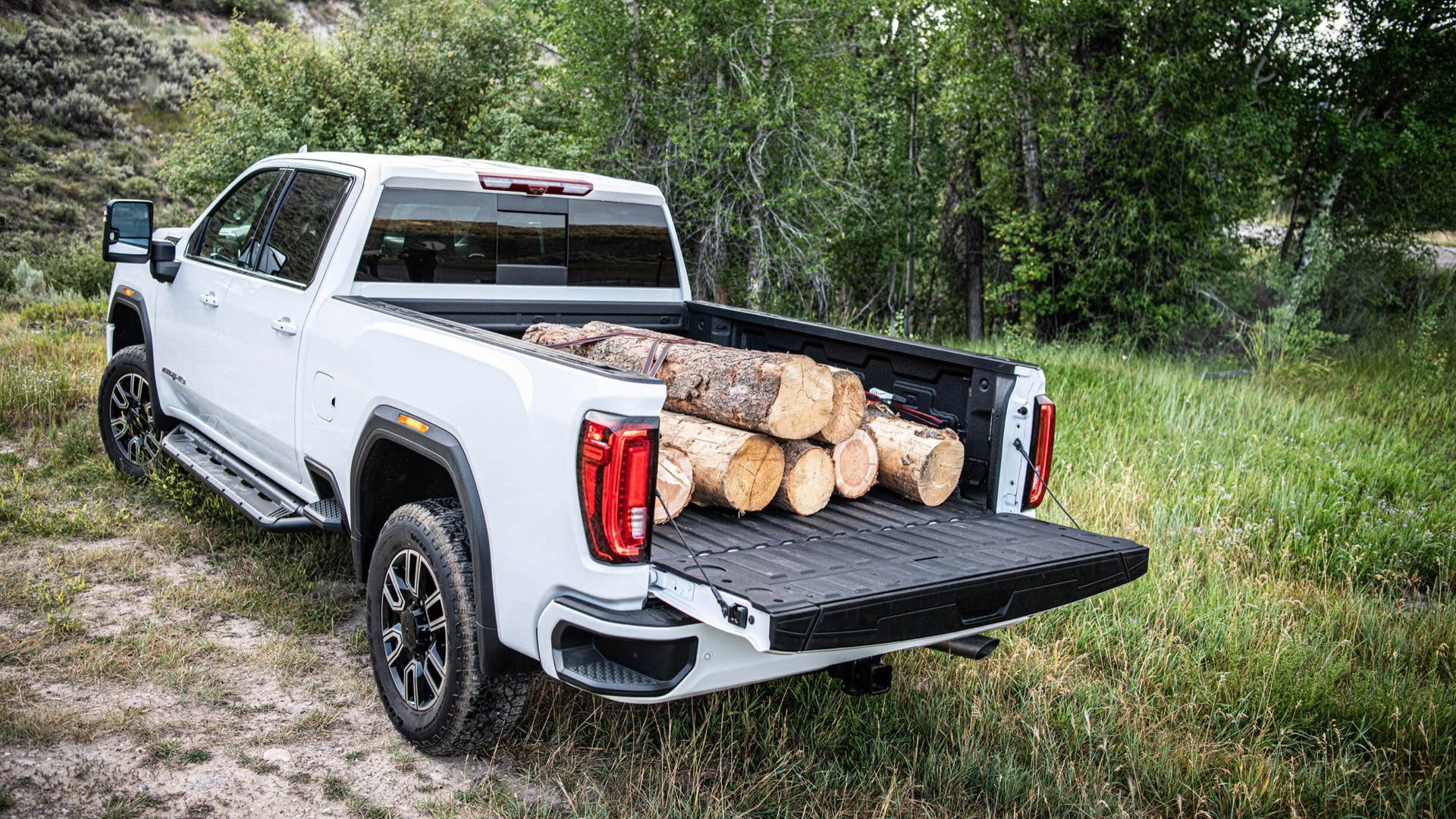 2020 GMC Sierra HD AT4 with logs in bed