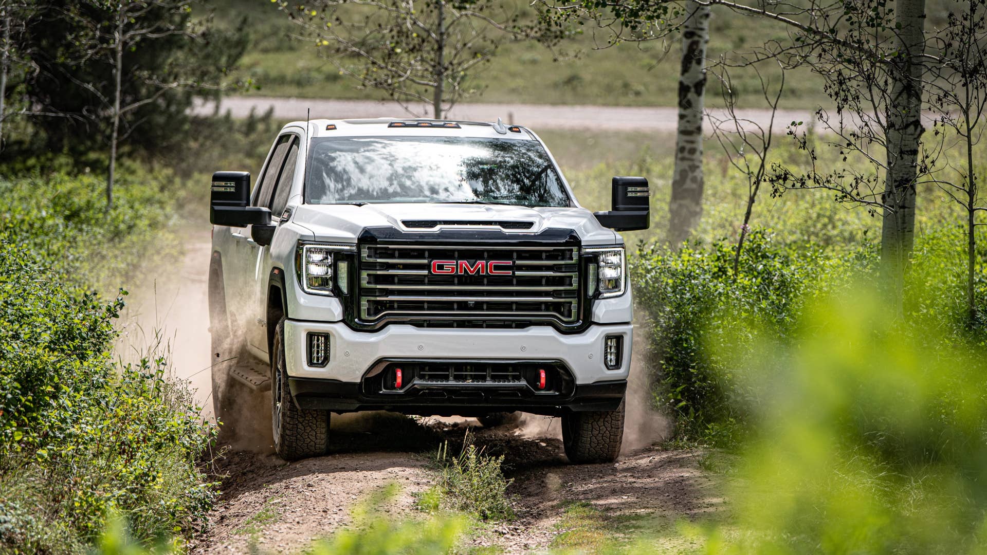 2020 GMC Sierra HD AT4 driving through mud