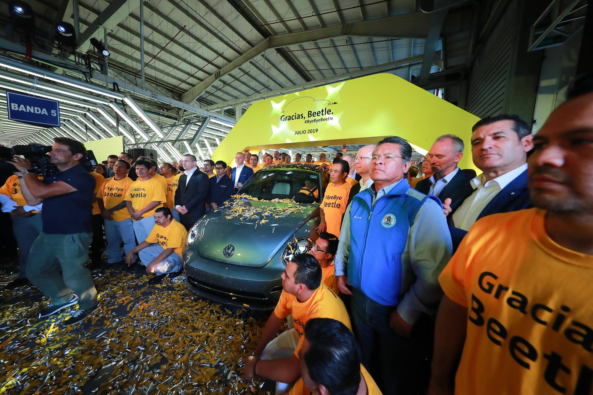CUAUTLANCINGO, MEXICO - JULY 10: Mariachi musicians play songs with workers and managers of Volkswagen during a ceremony to announce the cease of the production of the VW Beetle after 21 years in the market, at Volkswagen Plant on July 10, 2019 in Cuautlancingo, Mexico. Considered as the successor of the Volkswagen Type 1, the Beetle was produced during 21 years in the Cuautlancingo plant, it is estimated that over 17 millions of units were produced. (Photo by Hector Vivas/Getty Images)