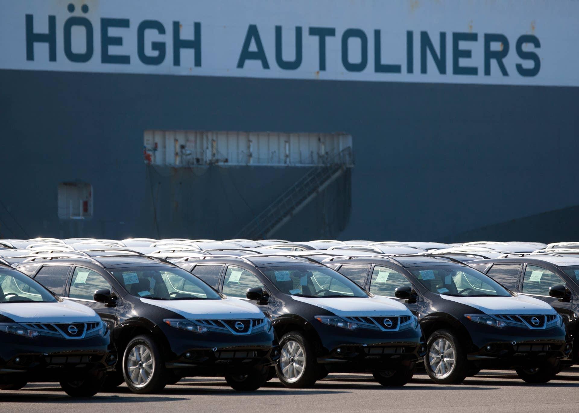 Nissan Motor Co. cars sit in a holding yard after being unloaded at the Port of Los Angleles in Wilmington, California, U.S., on Monday, Oct. 3, 2011. Nissan Motor Co., whose better supply of parts has buoyed inventory levels above its Japan-based rivals, reported a 25 percent gain in North American sales for September, better than the 18 percent average of five analysts' estimates. Photographer: Tim Rue/Bloomberg via Getty Images