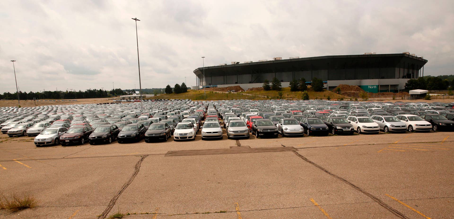 Diesel Volkswagen and Audi vehicles that VW bought back from consumers sit in the parking lot of the Pontiac Silverdome on August 4, 2017 in Pontiac, Michigan. Former Volkswagen executive Oliver Schmidt pleaded guilty on August 4 in US court to charges stemming from his role in the 'dieselgate' emissions-cheating scandal that has rocked the German automaker. Schmidt, who led the German automaker's US regulatory compliance office from 2012 to March 2015, will be sentenced at a hearing in early December and faces a maximum of seven years in prison on the two remaining charges of fraud conspiracy and violating the US Clean Air Act. / AFP PHOTO / JEFF KOWALSKY (Photo credit should read JEFF KOWALSKY/AFP/Getty Images)