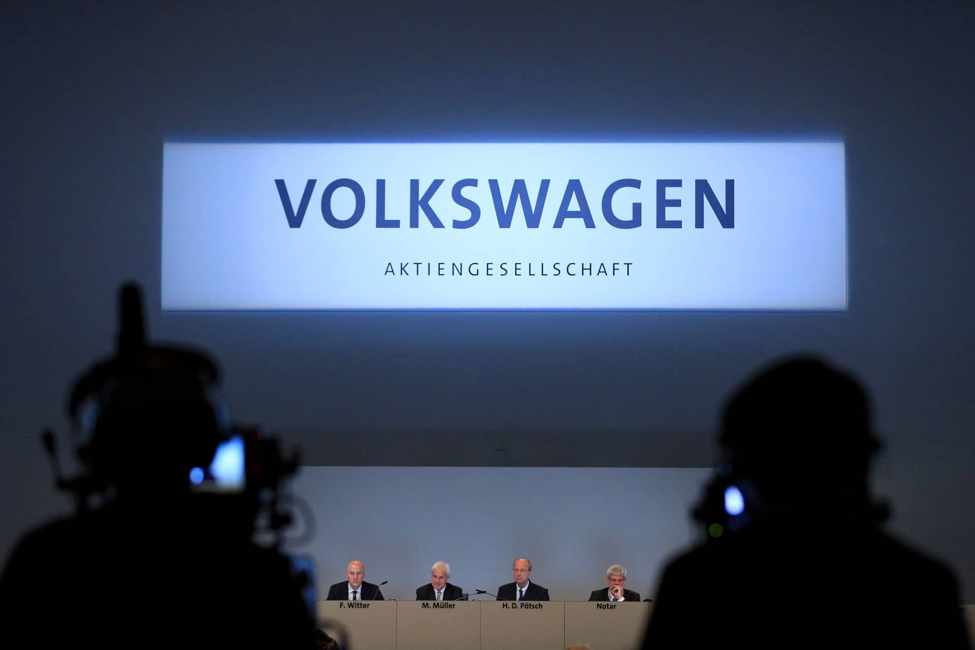 Left to right, Frank Witter, chief financial officer of Volkswagen AG, Matthias Mueller, chief executive officer of Volkswagen AG, Hans Dieter Poetsch, chairman of the supervisory board of Porsche Automobil Holding SE, attend an annual general meeting (AGM) with shareholders in Hannover, Germany, on Wednesday, June 22, 2016. Mueller sought to appease shareholder anger over the worst crisis in the carmakers history by shoring up internal controls to prevent a repeat of the diesel-emissions scandal. Photographer: Krisztian Bocsi/Bloomberg via Getty Images