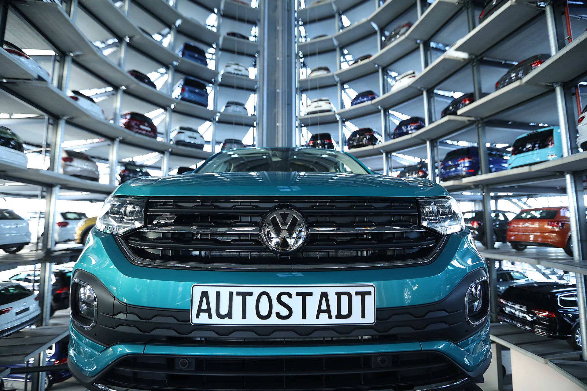 A new Volkswagen AG (VW) T-Cross compact SUV is guided into a storage bay inside one of the automaker's Autostadt delivery towers at the VW headquarters in Wolfsburg, Germany, on Tuesday, Dec. 4, 2018. VW would support eliminating tariffs on exported cars between the European Union and the U.S., the German automaker's strategy head Michael Jost said today at the Handelsblatt auto industry conference. Photographer: Krisztian Bocsi/Bloomberg via Getty Images