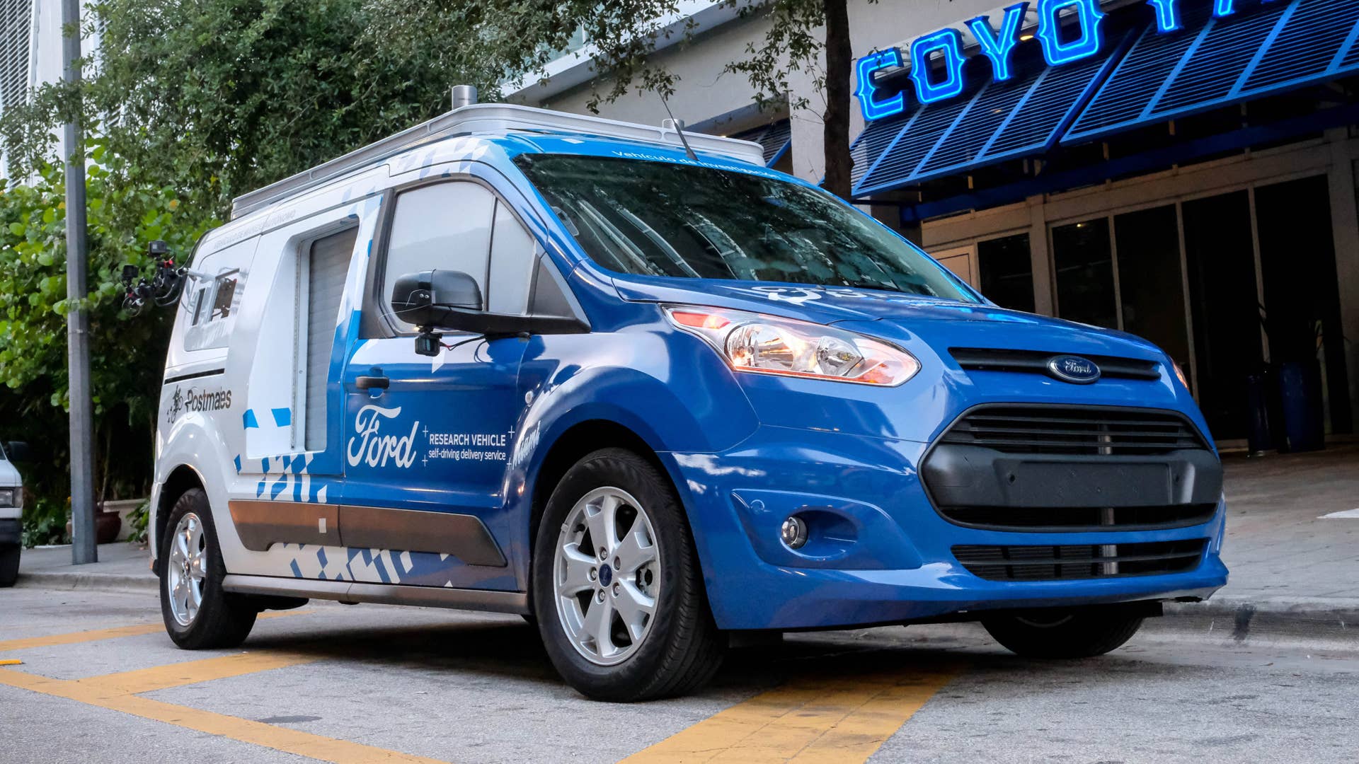 A new Ford Transit Connect self-driving research vehicle features three lockersâ-âone on the passenger side and two in the backâ-âthat help deliver both food and goods
