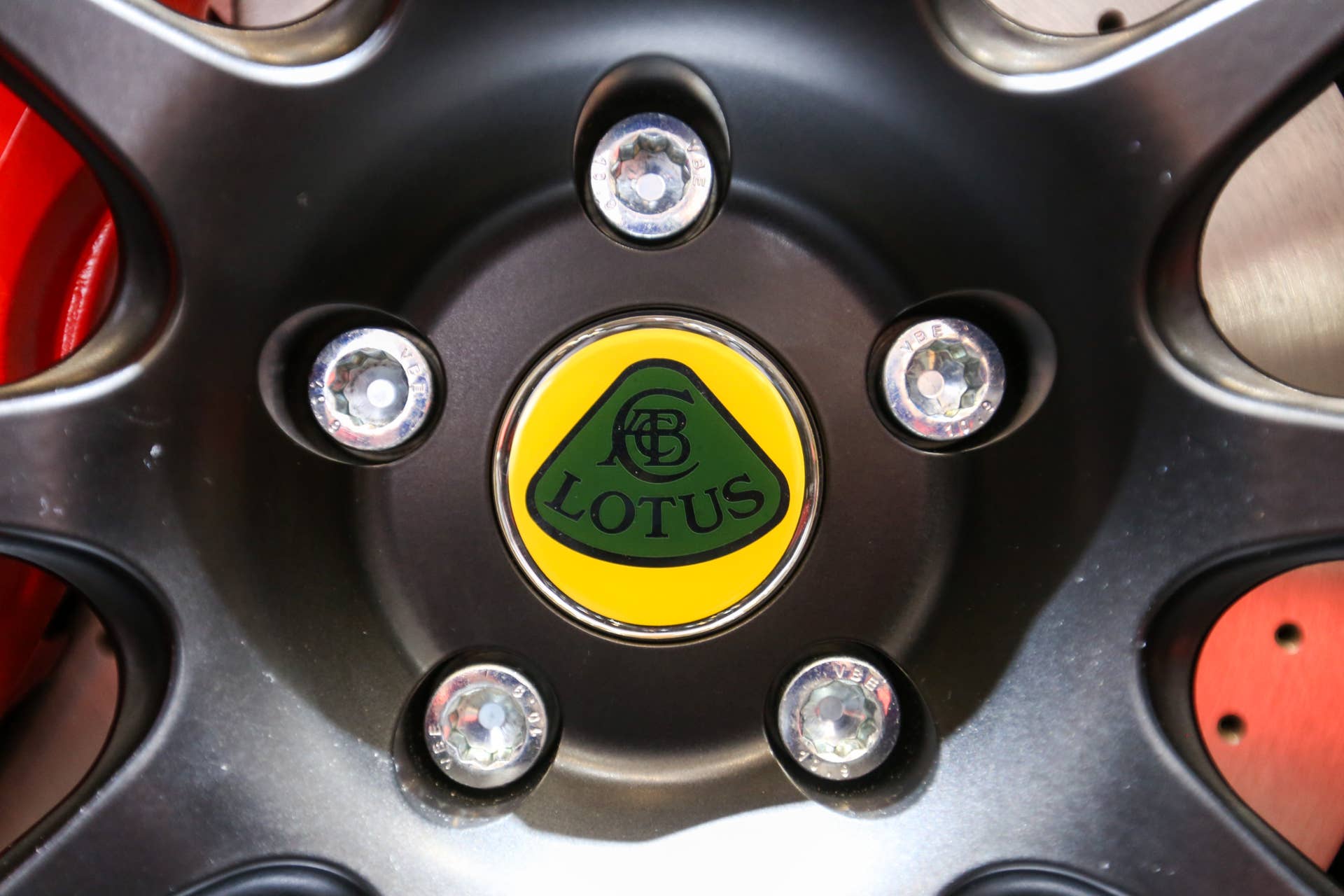 The Lotus marque sits in the center of an alloy wheel on one of their automobiles, produced by Group Lotus Plc, a luxury unit of Proton Holdings Bhd., on the first day of the 86th Geneva International Motor Show in Geneva, Switzerland, on Tuesday, March 1, 2016. The show opens to the public on March 3, and will showcase the latest models from the world's top automakers. Photographer: Chris Ratcliffe/Bloomberg via Getty Images