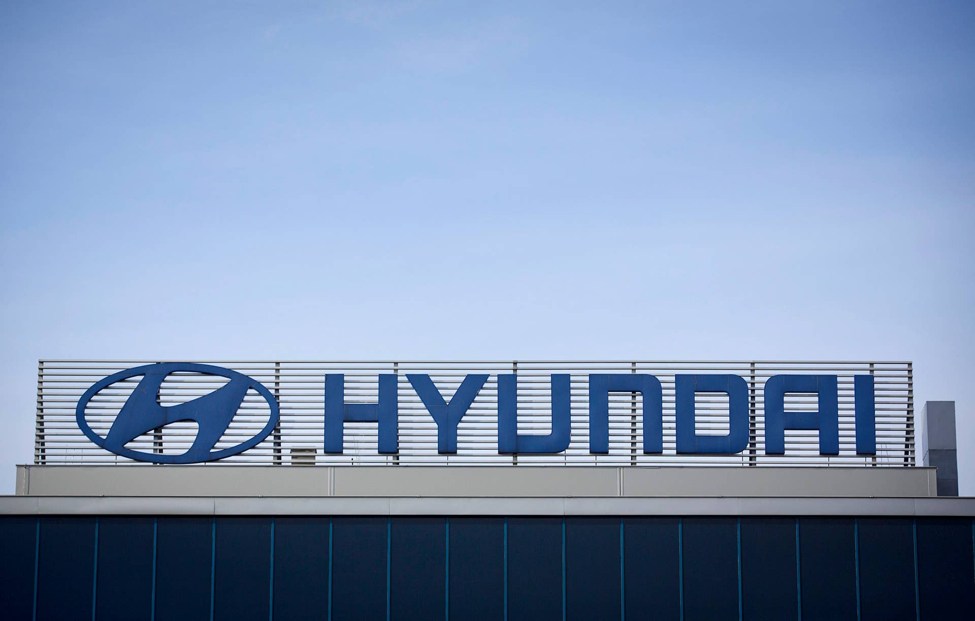A logo sits on display above the headquarters of the Hyundai Motor Co. manufacturing plant in Nosovice, Czech Republic, on Tuesday, Dec. 3, 2013. Exports, which account for about 80 percent of Czech GDP, are led by manufacturers including the factories of carmakers Hyundai Motor Co., Volkswagen AG's Skoda Auto AS, Peugeot SA and Toyota Motor Corp. Photographer: Martin Divisek/Bloomberg via Getty Images