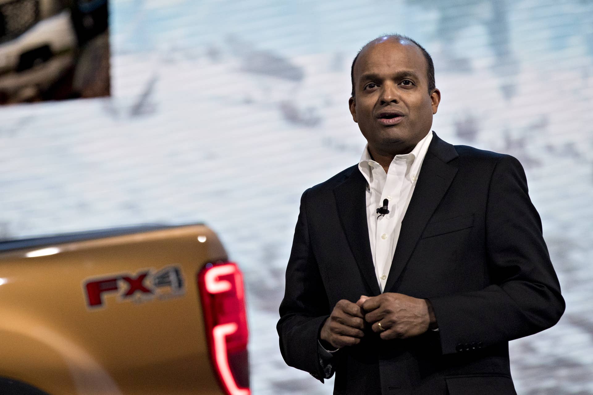 Raj Nair, executive vice president and chief technical officer of product development at Ford Motor Co., speaks next to a 2019 Ford Motor Co. Ranger mid-size pickup truck at an event during the 2018 North American International Auto Show (NAIAS) in Detroit, Michigan, U.S., on Sunday, Jan. 14, 2018. The American version of the Ranger debuting Sunday at the Detroit auto show and going on sale next year reverses course on Ford's 2011 decision to depart what was then a declining market for smaller pickups in the first years out of the recession. Photographer: Andrew Harrer/Bloomberg via Getty Images