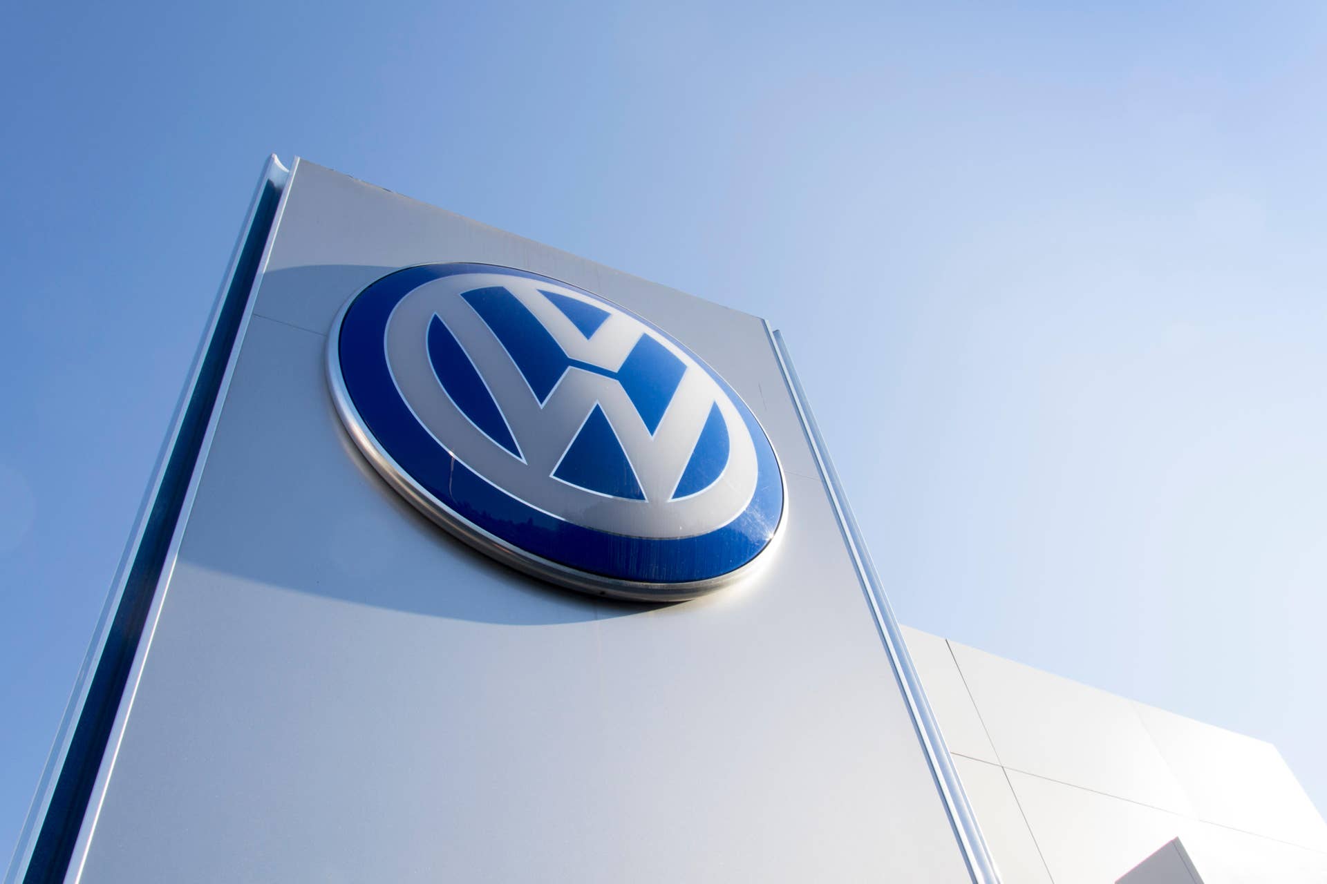 PRAGUE, CZECH REPUBLIC - OCTOBER 1: Volkswagen car maker logo on a building of dealership on October 1, 2015 in Prague, Czech republic.