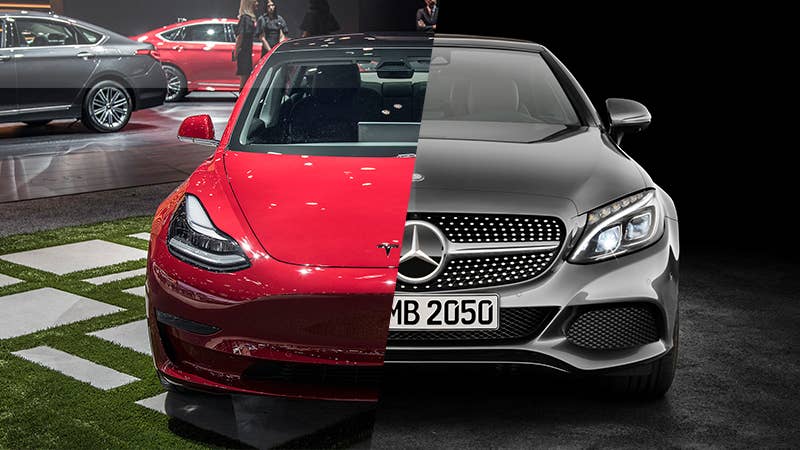A Tesla Model 3 and Mercedes-Benz C 200d