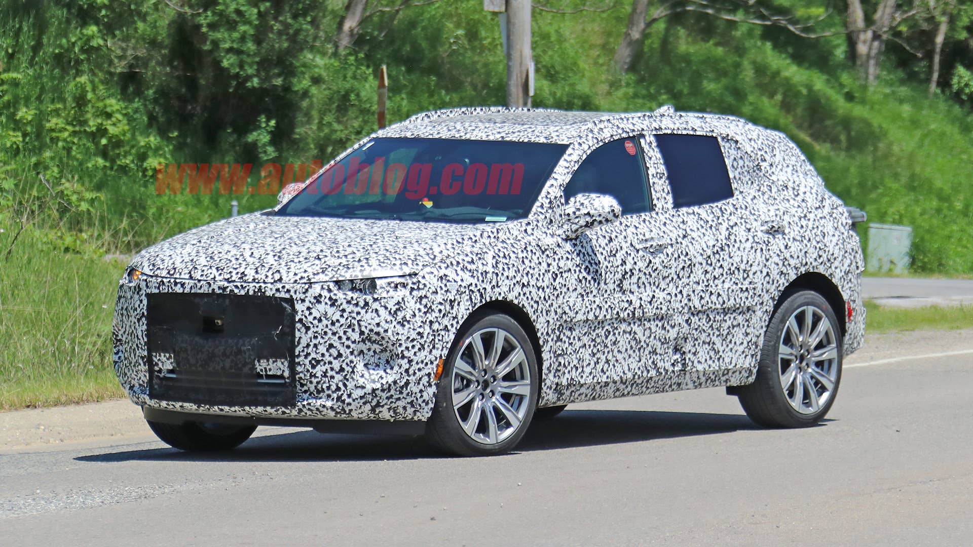 Buick Enspire crossover prototype in camouflage vinyl wrap