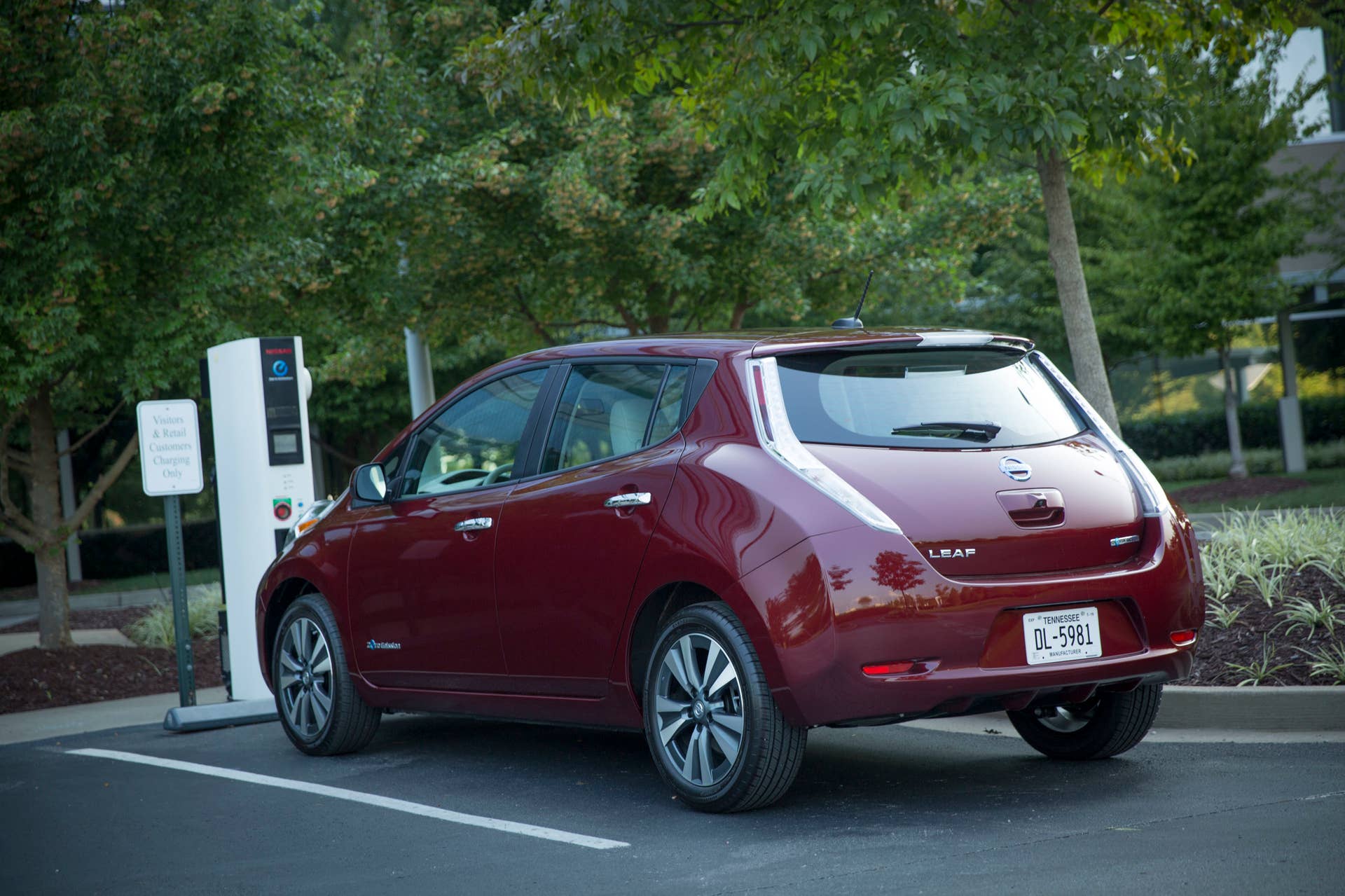 2016 Nissan Leaf red rear 3/4 charging port parked