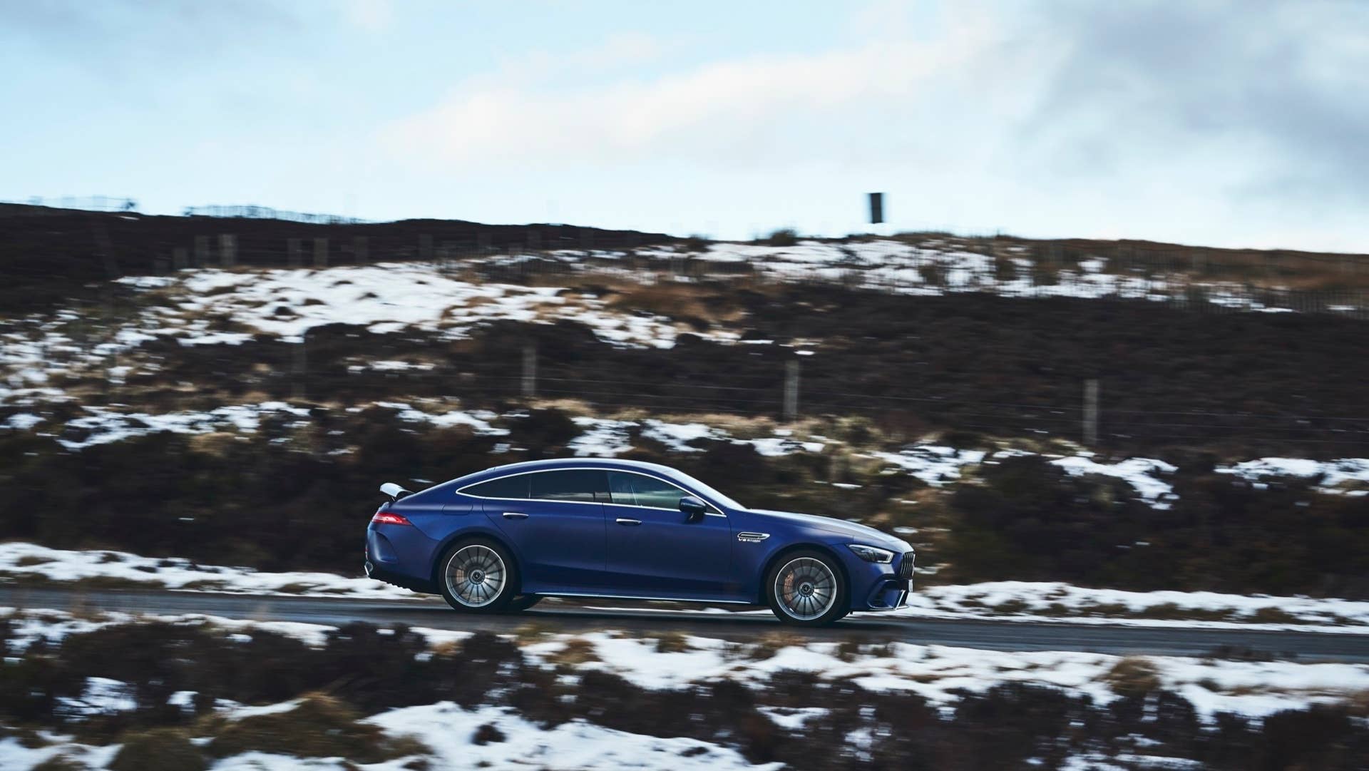 2020 Mercedes-AMG GT 63 S Sedan side blue snow road driving