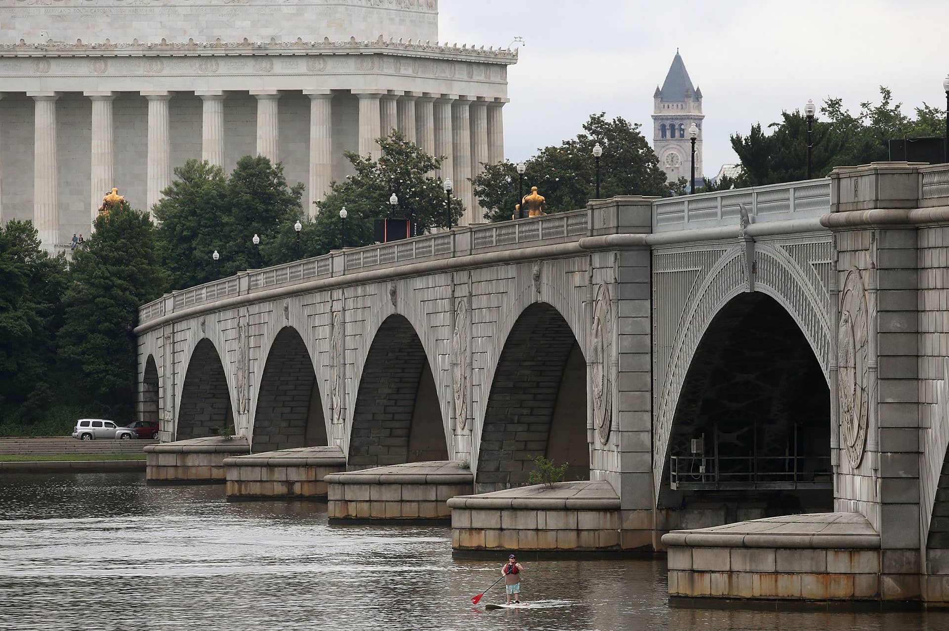 WASHINGTON, DC - JUNE 05: A man uses a paddle board on the Potomac River near the Memorial Bridge near the Lincoln Memorial June 5, 2015 in Washington, DC. The bridge is one of 61,000 bridges across America that the Department of Transportation said were structurally deficient and in need of repair. Parts of the 80 year old bridge's steel support beams are rapidly corroding and no longer meets federal load bearing standards. (Photo by Mark Wilson/Getty Images)