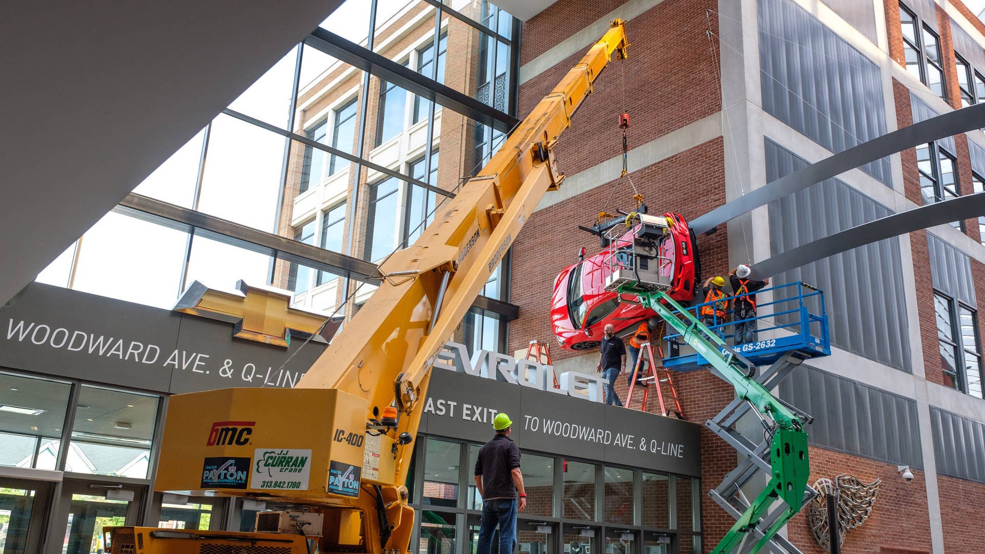 Workers mount a next generation 2020 Corvette C8 Stingray to a wall above the Chevrolet portal Tuesday, September 10, 2019 at Little Caesar's Arena in Detroit, Michigan. Chevrolet is the official vehicle of Little Caesar's Arena - home of the Detroit Red Wings and Detroit Pistons. (Photo by Steve Fecht for Chevrolet)