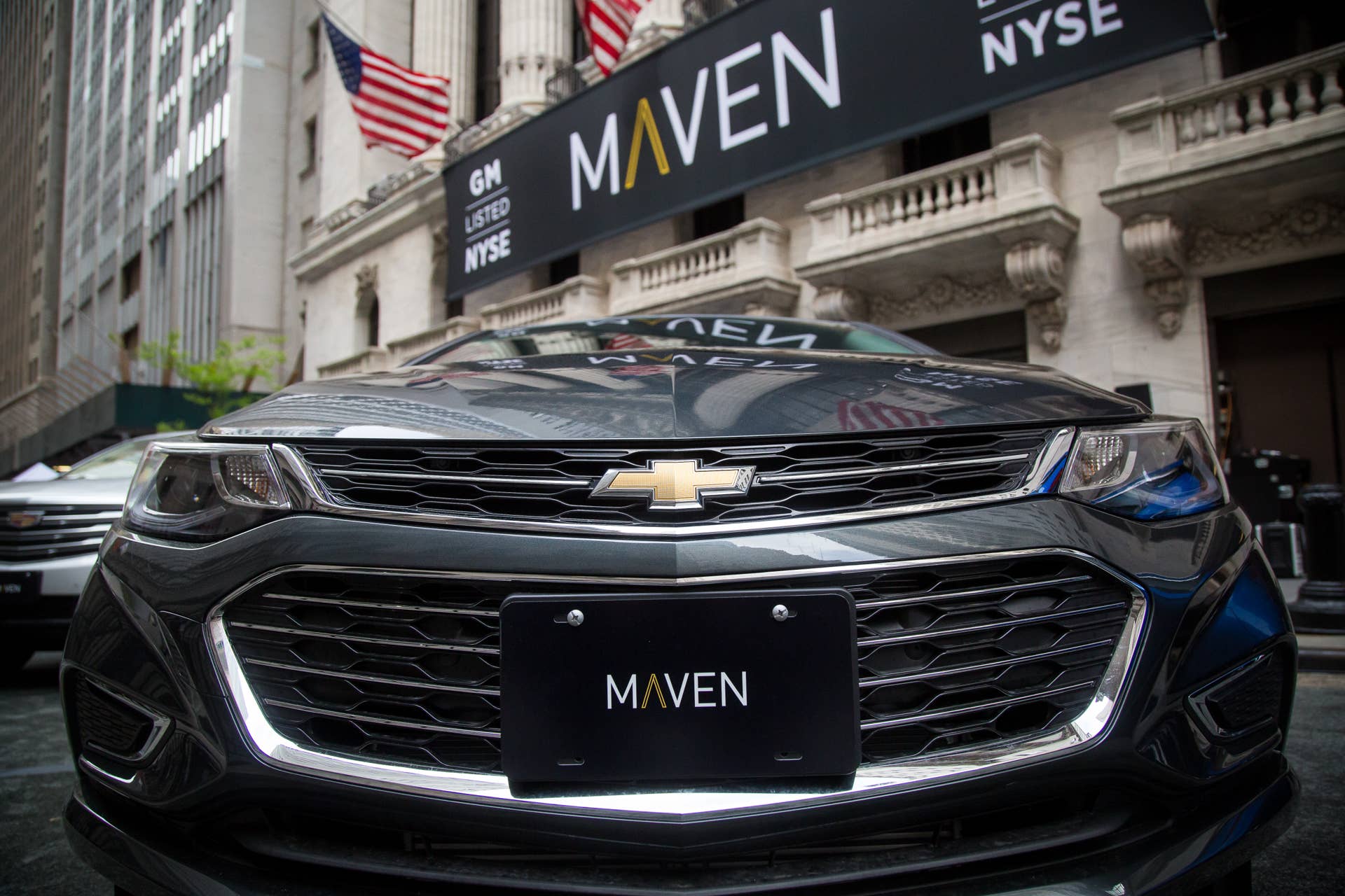 A General Motors Co. Maven car-sharing service vehicle sits parked in front of the New York Stock Exchange (NYSE) in New York, U.S., on Monday, May 15, 2017. U.S. stocks climbed after equities posted their first back-to-back drop in almost a month, as investors awaited earnings reports this week. Photographer: Michael Nagle/Bloomberg via Getty Images