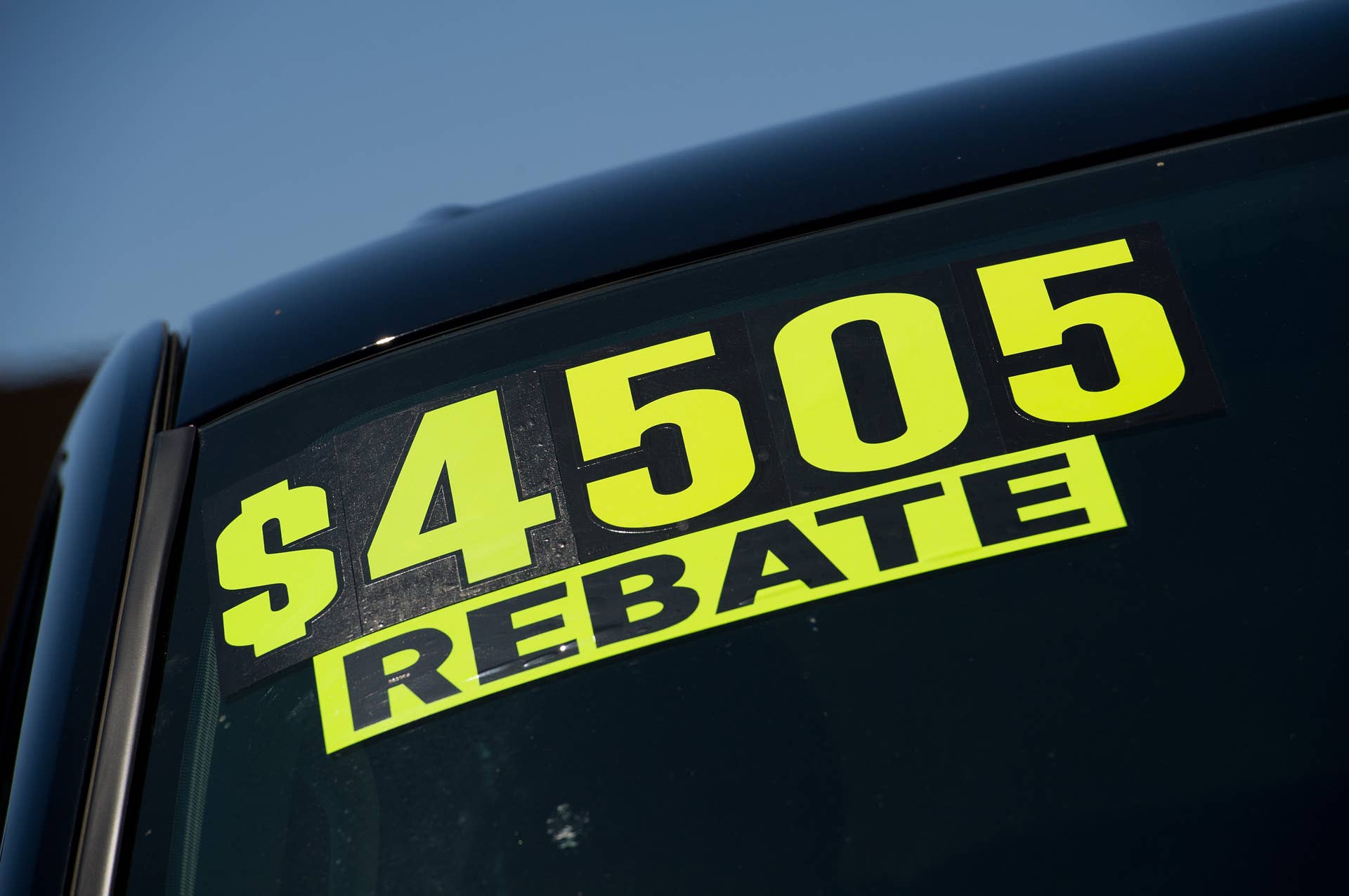 A rebate sticker is displayed on a General Motors Corp. Chevrolet Silverado pickup truck for sale at a dealership in Colma, California, U.S., on Tuesday, July 5, 2011. The Detroit-based automaker, 33 percent owned by the U.S. after its 2009 bankruptcy, has 280,000 Silverado and GMC Sierra pickups on dealers' lots around the country. Photographer: David Paul Morris/Bloomberg via Getty Images