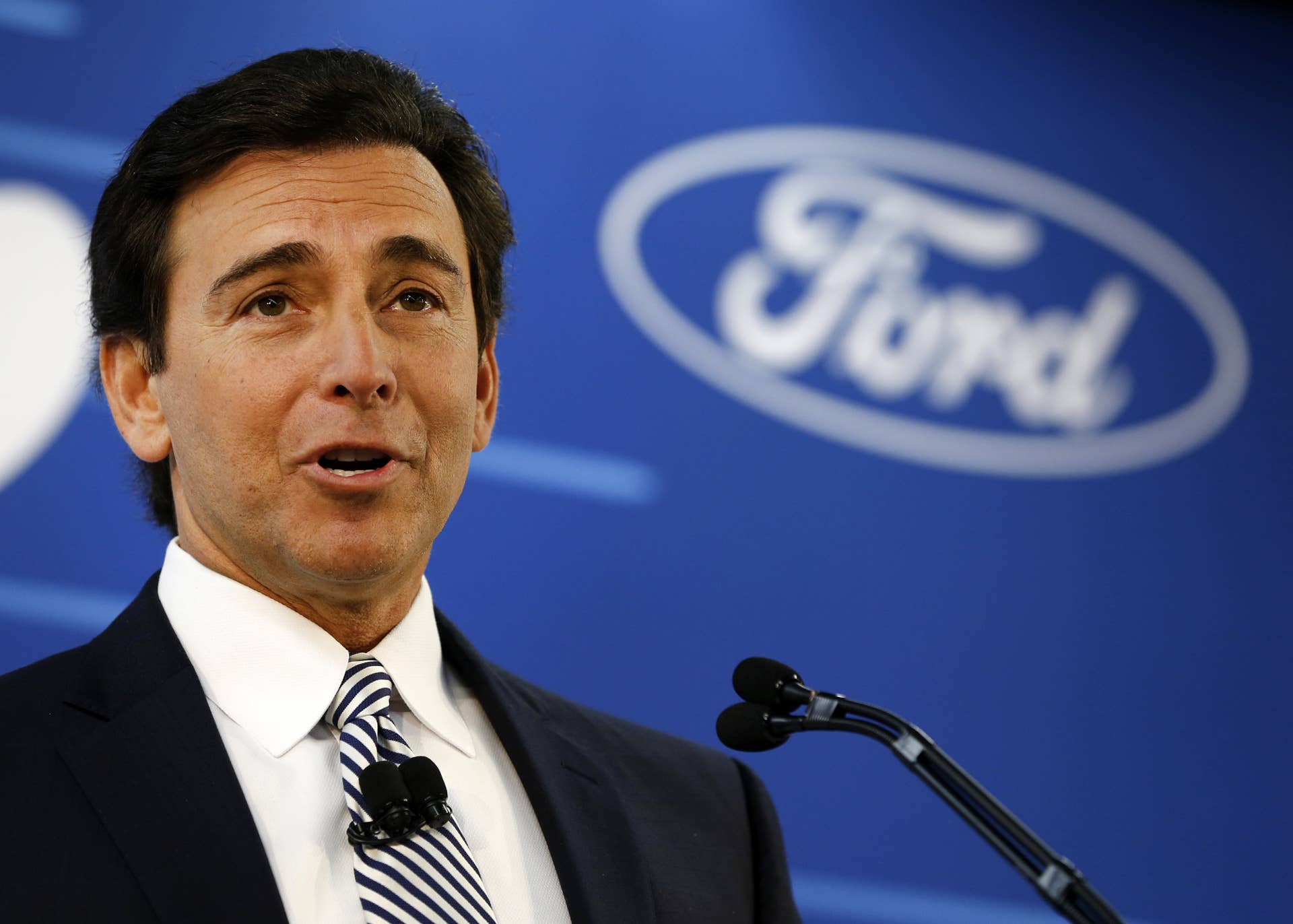Mark Fields, chief executive officer of Ford Motor Co., speaks during a news conference at the company's assembly plant in Flat Rock, Michigan, U.S., on Tuesday, Jan. 3, 2017. Ford Motor Co. will scrap plans to build a $1.6 billion plant in Mexico, after coming under criticism by President-elect Donald Trump for shifting small-car production south of the border. Photographer: Jeff Kowalsky/Bloomberg via Getty Images