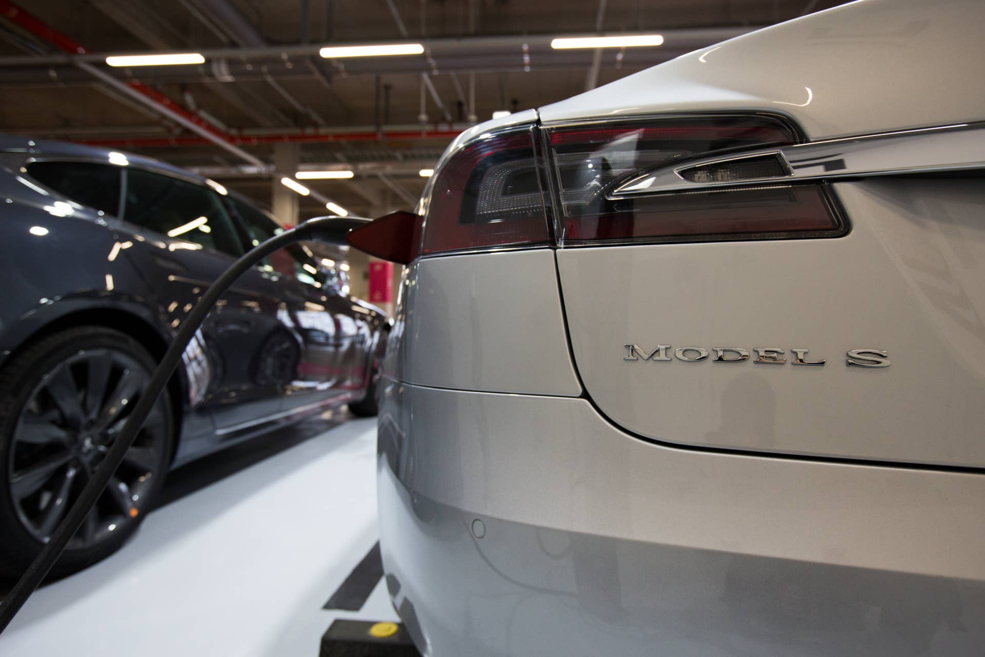 A Tesla Inc. Model S 90D electric vehicle is charged at the company's charging station in the Starfield Hanam shopping complex, operated by Shinsegae Co., in Hanam, Gyeonggi Province, South Korea, on Wednesday, March 15, 2017. Tesla produced almost 84,000 vehicles in 2016 and plans to make half a million in 2018, then 1 million in 2020. Photographer: SeongJoon Cho/Bloomberg via Getty Images