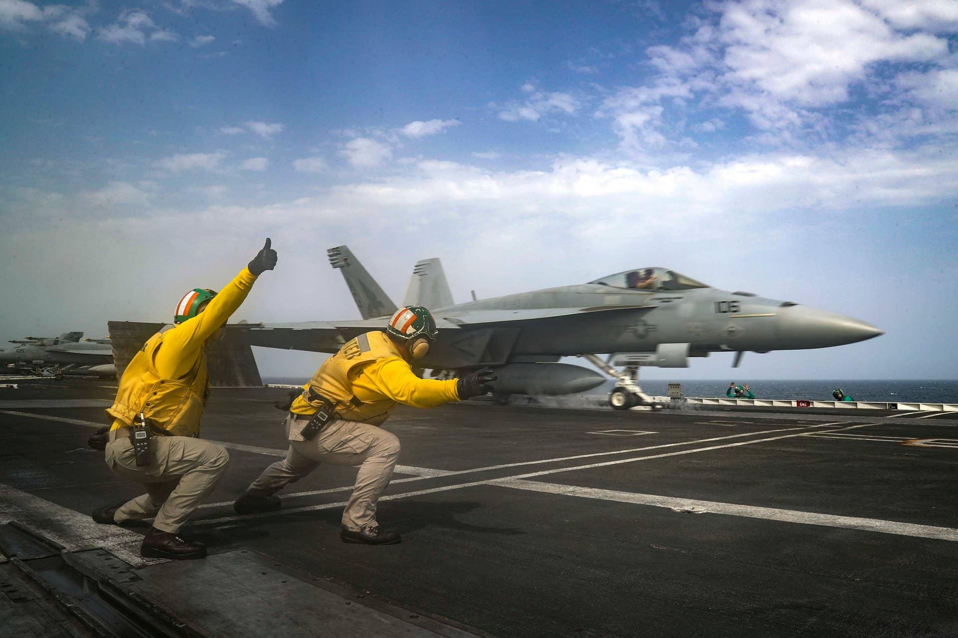 In this Thursday, May 16, 2019 photo released by the U.S. Navy, Lt. Nicholas Miller, from Spring, Texas, and Lt. Sean Ryan, from Gautier, Miss., launch an F-18 Super Hornet from the deck of the USS Abraham Lincoln aircraft carrier in the Arabian Sea. On Saturday, May 18, 2019, U.S. diplomats warned that commercial airliners flying over the wider Persian Gulf faced a risk of being "misidentified" amid heightened tensions between the U.S. and Iran. (Mass Communication Specialist 3rd Class Jeff Sherman, U.S. Navy via AP)