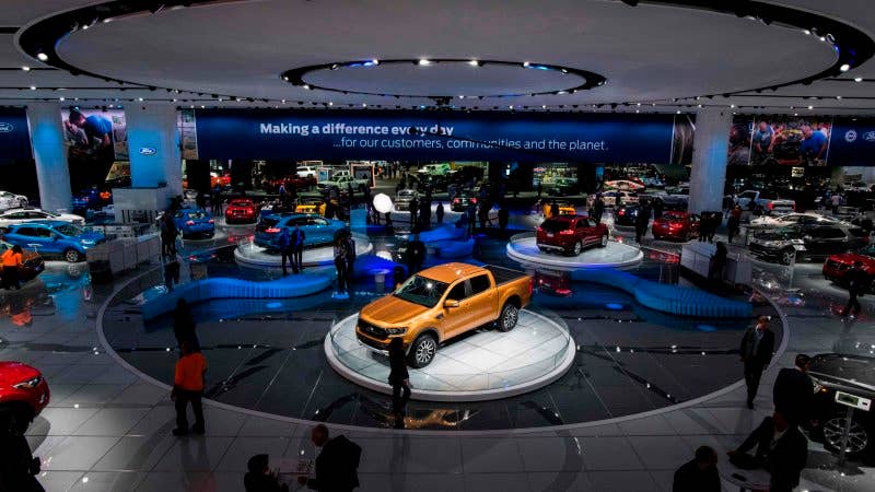 People visit the Ford stand during the press preview at the 2018 North American International Auto Show (NAIAS) in Detroit, Michigan, on January 16, 2018. Car makers appealed to Americans' deep love of SUVs and trucks at the Detroit Auto Show, unveiling a host of choices from luxurious to utilitarian, while also beefing up the humble sedan. / AFP PHOTO / Jewel SAMAD (Photo credit should read JEWEL SAMAD/AFP/Getty Images)