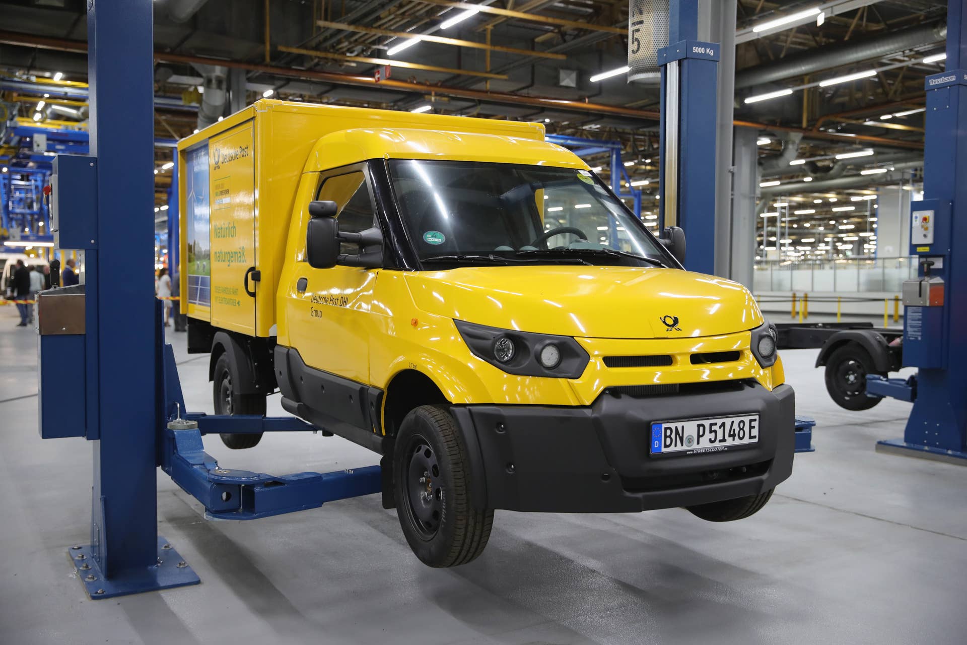 DUEREN, GERMANY - MAY 30: Workers assemble StreetScooter electric delivery vans at the StreetScooter plant on May 30, 2018 in Dueren, Germany. Deutsche Post DHL, StreetScooter's parent company, has announced it is doubling production of the electric vans as it wins further sales contracts. Most recently it announced a deal with the British company Milk & More to supply it with 200 vans. (Photo by Andreas Rentz/Getty Images)