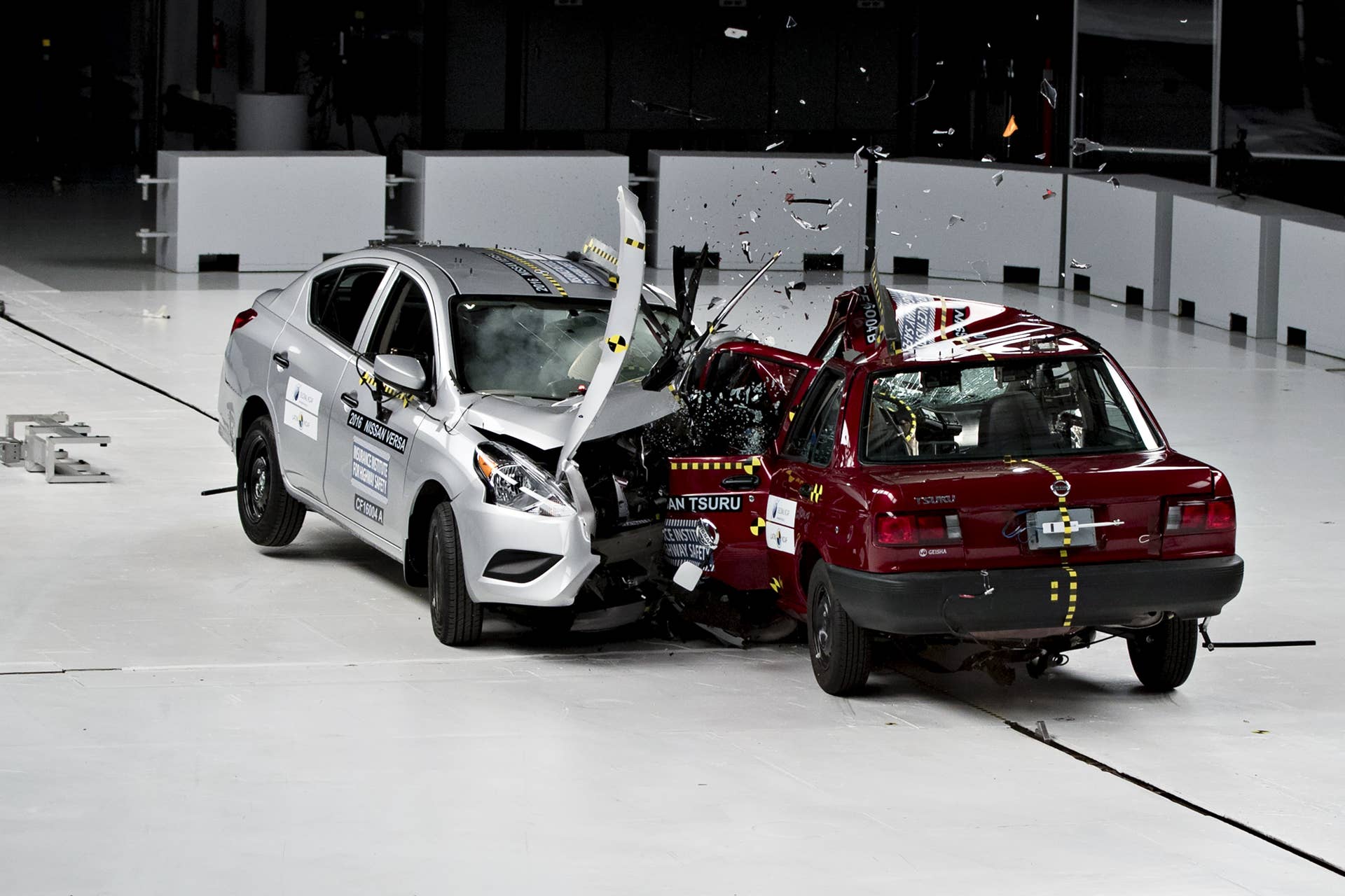 A 2016 Nissan Motor Co. Versa, left, is test crashed into a 2015 Nissan Motor Co. Tsuru at a combined closing speed of 80mph (129km/h) inside Insurance Institute for Highway Safety (IIHS) headquarters in Ruckersville, Virginia, U.S., on Thursday, Oct. 27, 2016. The Versa, sold in the United States and rated Good by the IIHS, and the Tsuru, sold in Mexico and rated Zero Stars by the New Car Assessment Programme for Latin America and the Caribbean (Latin NCAP), test highlights the difference in safety standards between two base line sedan models sold by the same manufacturer in different countries. Photographer: Andrew Harrer/Bloomberg via Getty Images