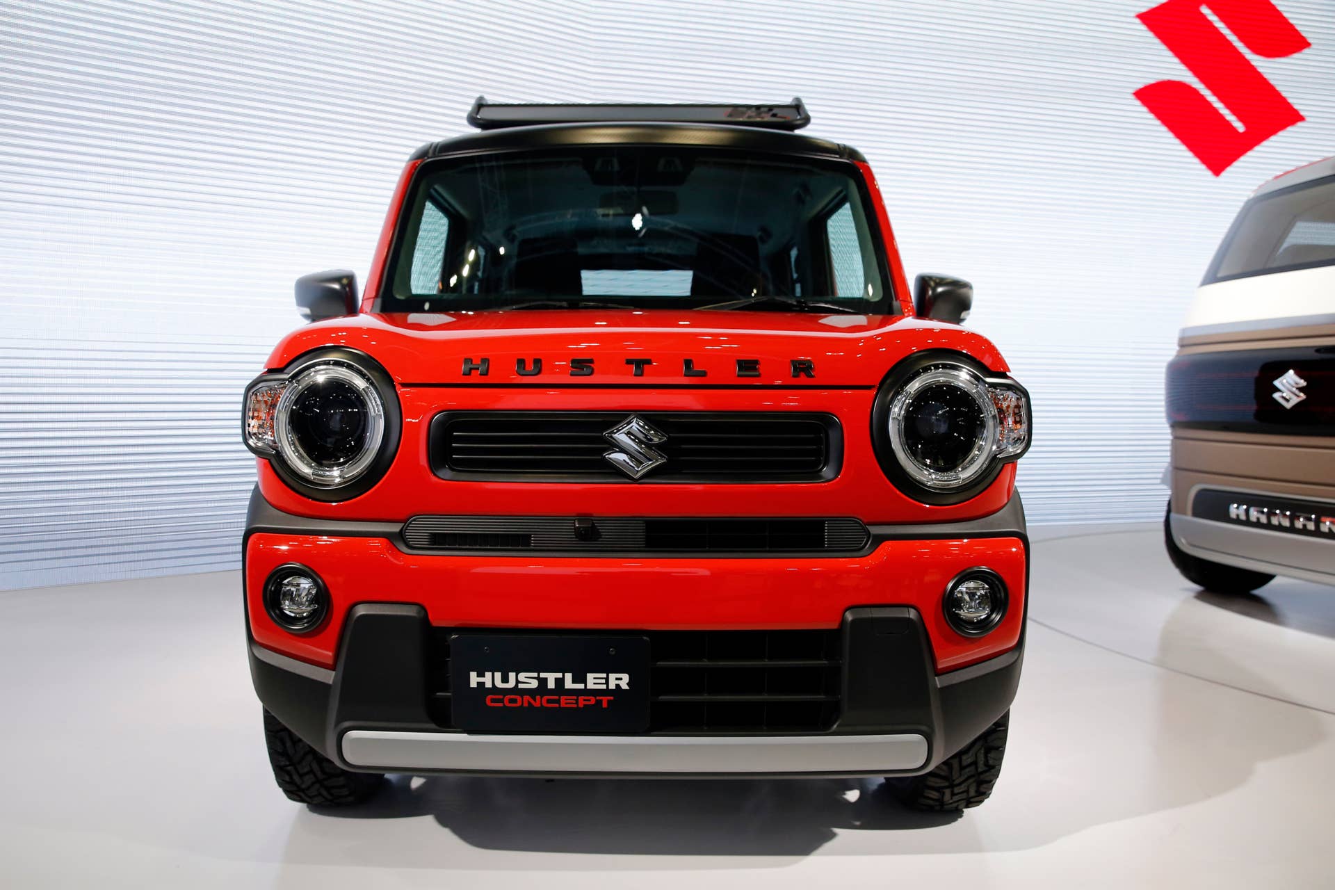 A Suzuki Hustler concept is displayed during the media preview of the Tokyo Motor Show Wednesday, Oct. 23, 2019, in Tokyo. (AP Photo/Kiichiro Sato)