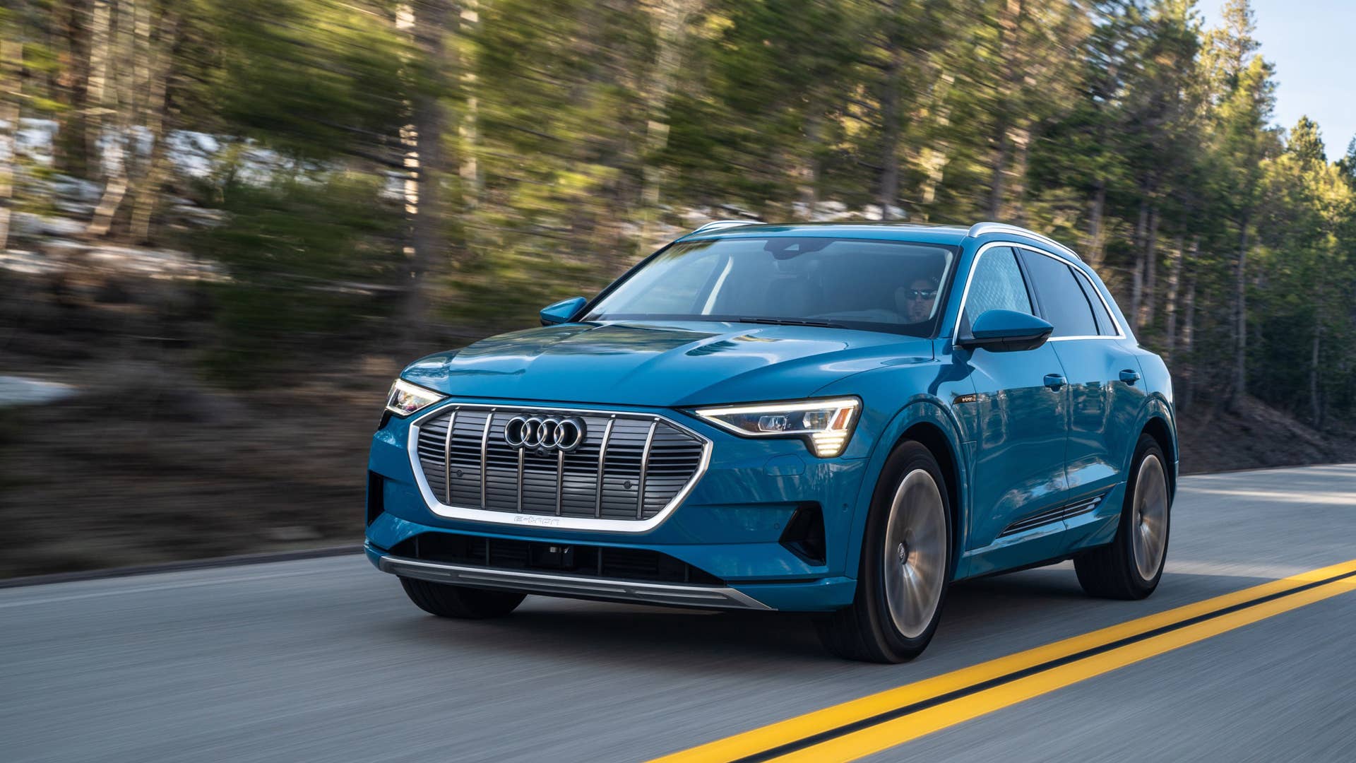 The 2020 Audi E-Tron electric luxury crossover in the mountains.