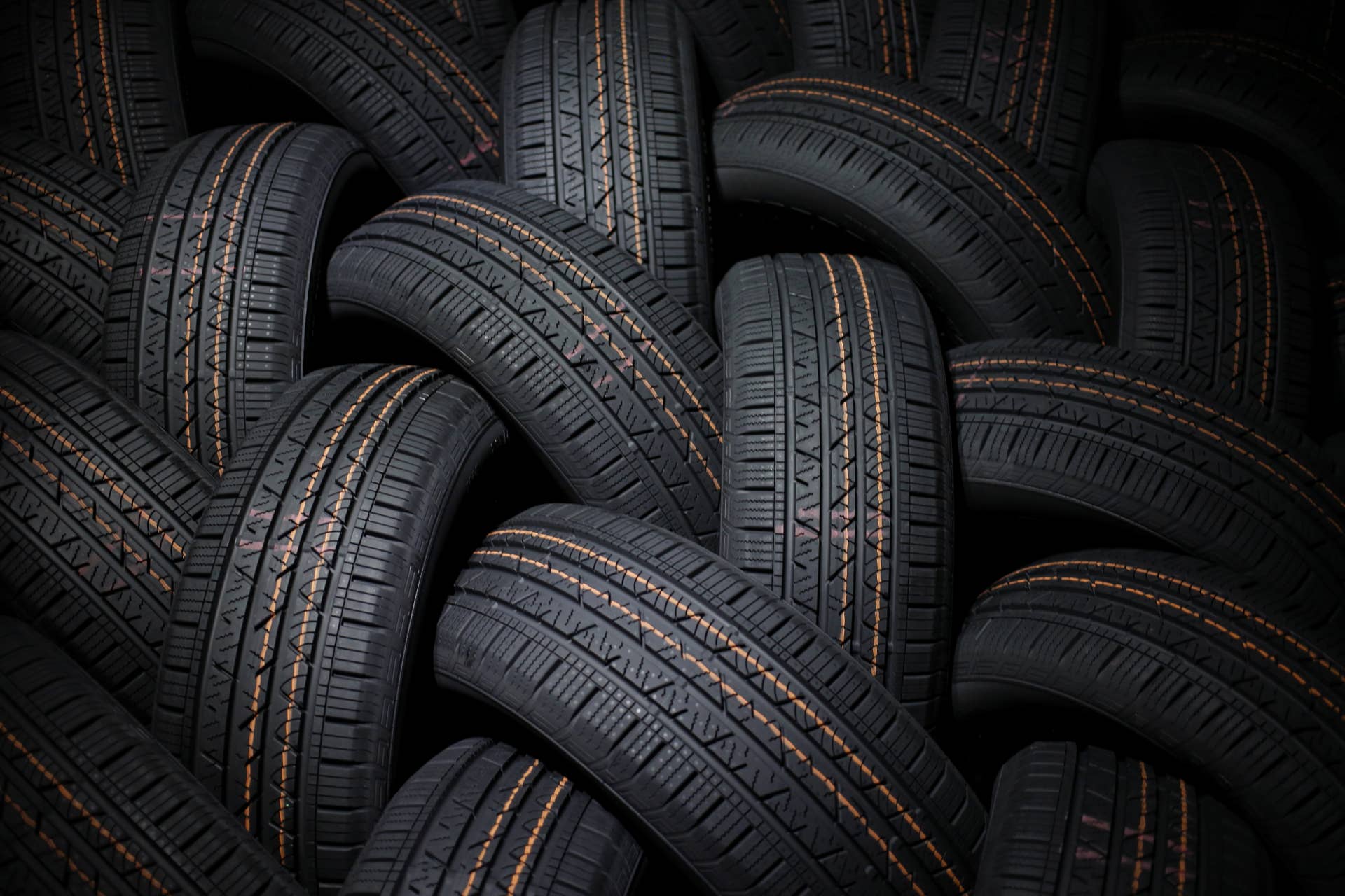 Automotive tires sit stacked after being loaded onto a truck for shipment at the Continental Tire Sumter plant distribution warehouse in Sumter, South Carolina, U.S., on Thursday, Dec. 17, 2015. The lowest U.S. rubber prices since 2009 have helped tiremakers expand profit margins and provide a strong outlook for 2016 as North American demand for auto parts continues to climb toward pre-recession levels, according to reports by Bloomberg Industries. Photographer: Luke Sharrett/Bloomberg via Getty Images