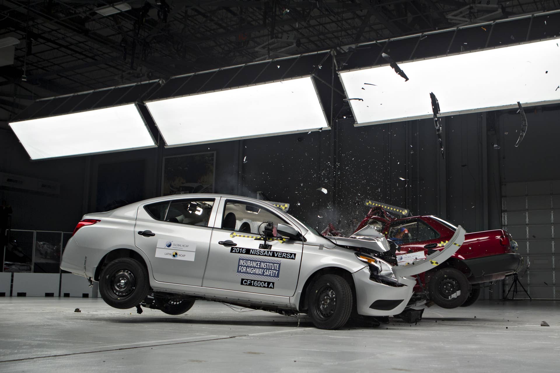 A 2016 Nissan Motor Co. Versa, left, is test crashed into a 2015 Nissan Motor Co. Tsuru at a combined closing speed of 80mph (129km/h) inside Insurance Institute for Highway Safety (IIHS) headquarters in Ruckersville, Virginia, U.S., on Thursday, Oct. 27, 2016. The Versa, sold in the United States and rated Good by the IIHS, and the Tsuru, sold in Mexico and rated Zero Stars by the New Car Assessment Programme for Latin America and the Caribbean (Latin NCAP), test highlights the difference in safety standards between two base line sedan models sold by the same manufacturer in different countries. Photographer: Andrew Harrer/Bloomberg via Getty Images
