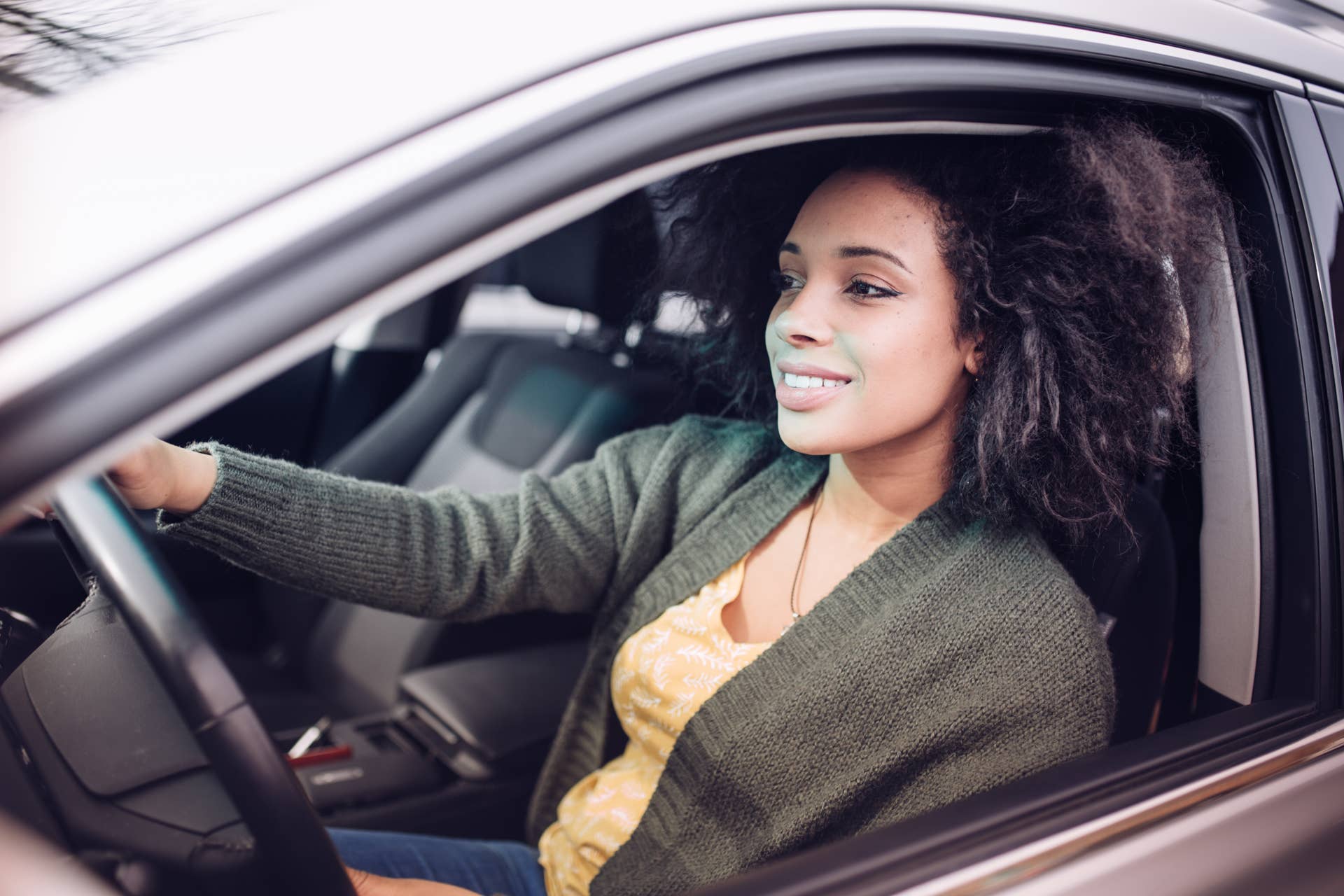 Smiling student in a car