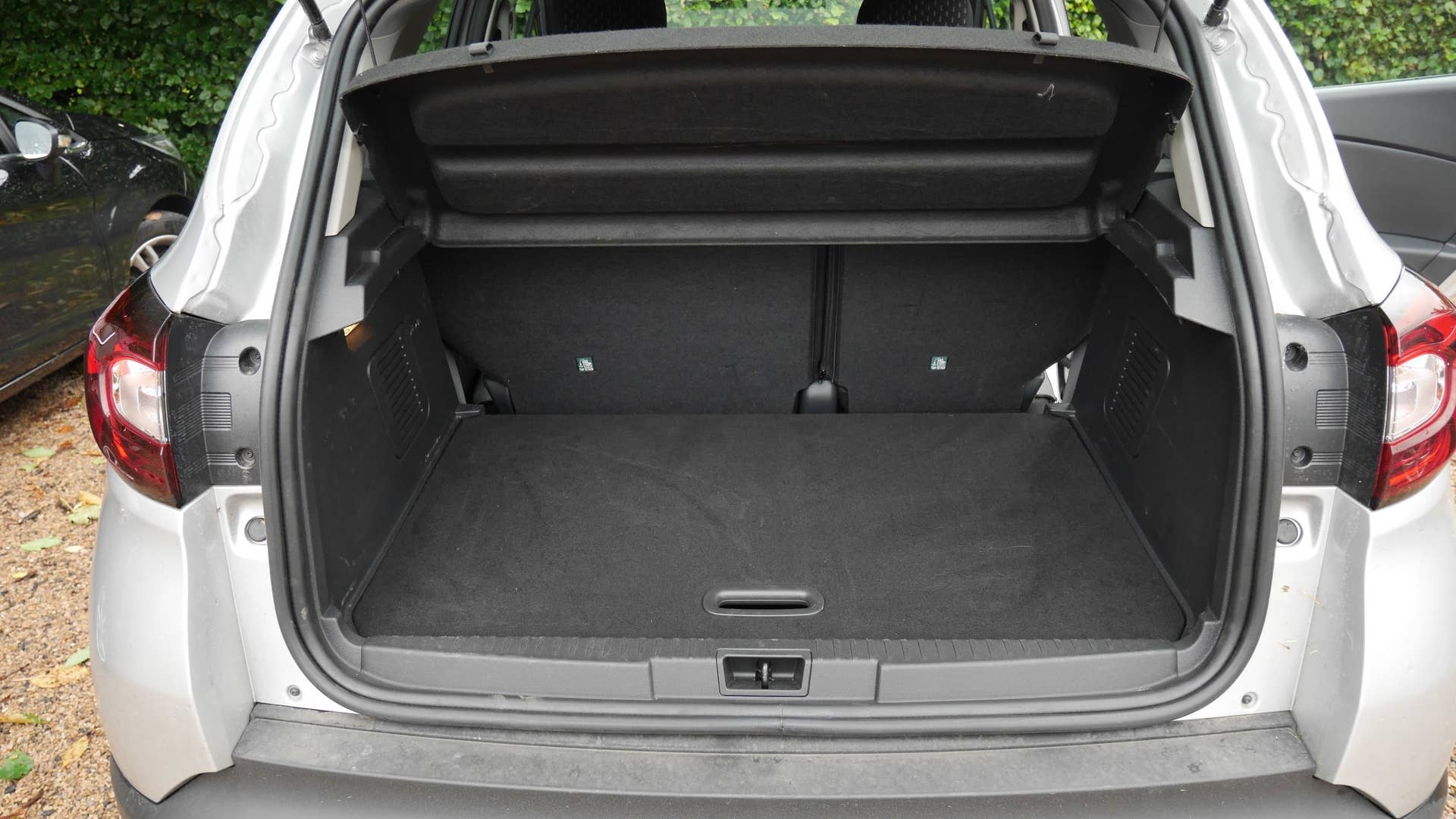 The cargo area with the seat pushed forward.