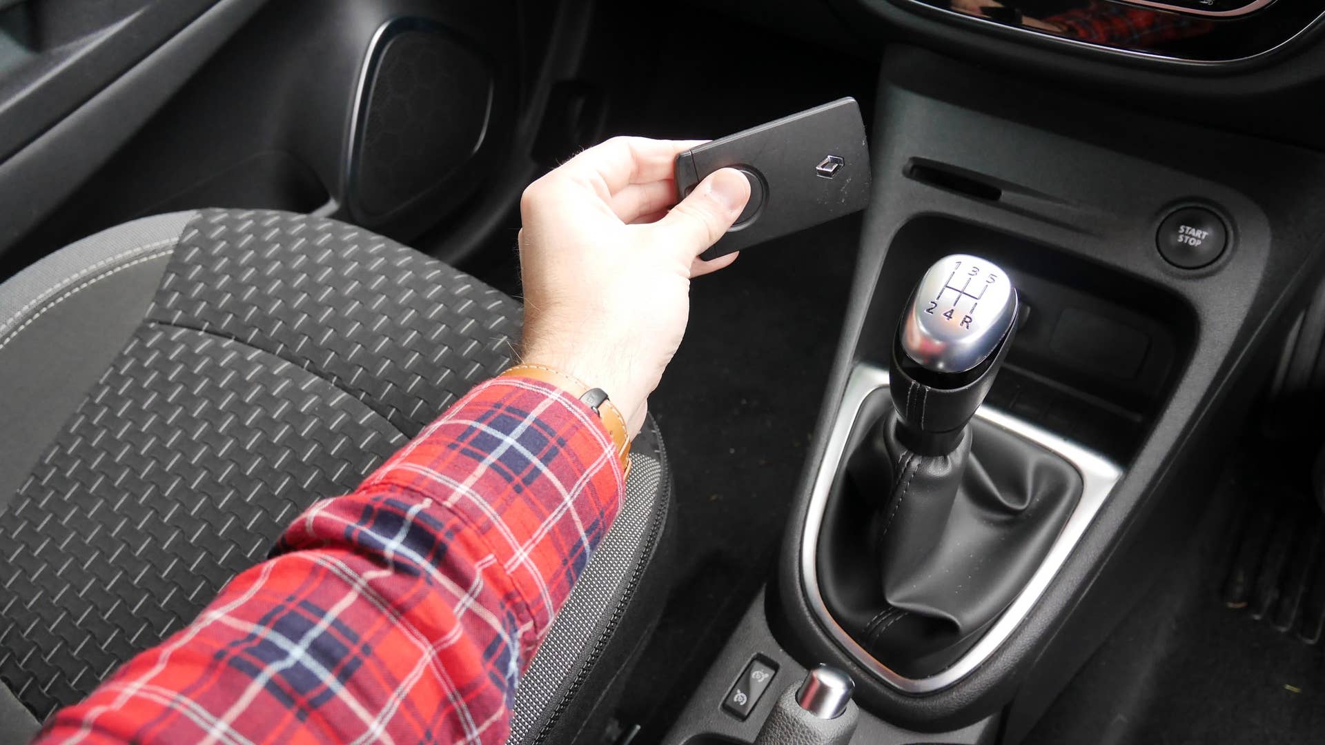 The key is a card-like thing that fits your pocket quite nicely. Plaid shirt a Scotland requirement.