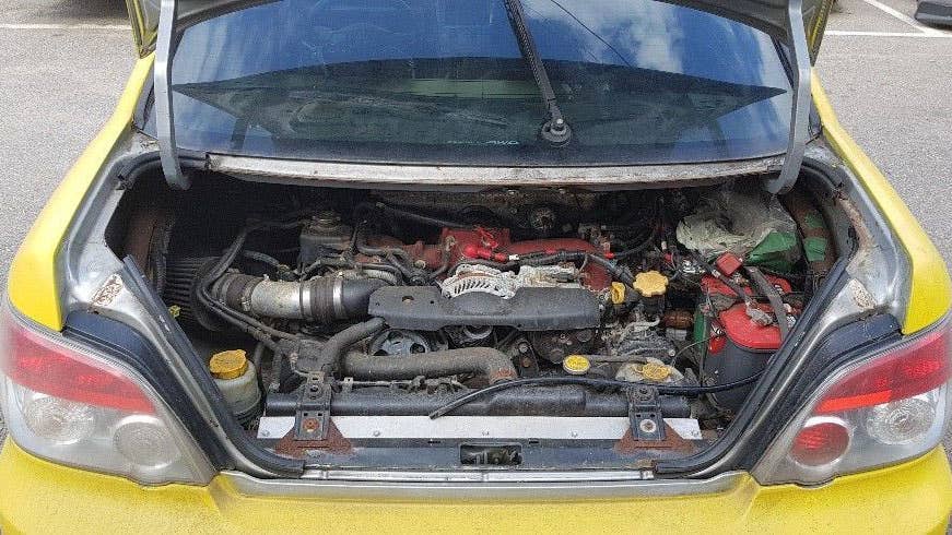 The car's body has been flipped, so the engine is in the trunk.