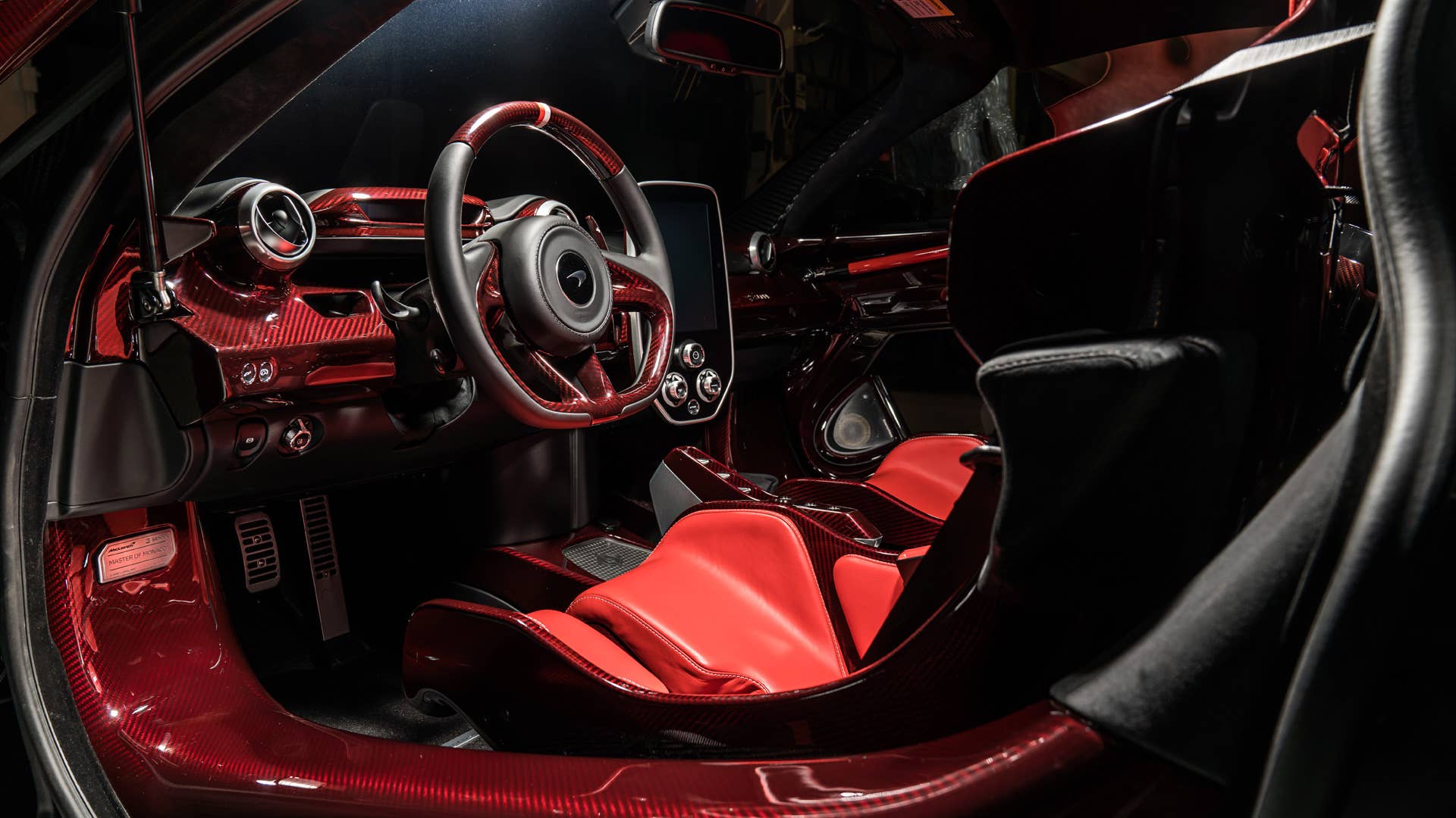 Each car gets a name and celebrates a Formula 1 race track where Ayrton Senna scored an especially outstanding victory. All three are dressed in gloss black carbon fiber, accented with the colors of the F1 circuit's country, and adorned with Ayrton's car number on the wing endplates.