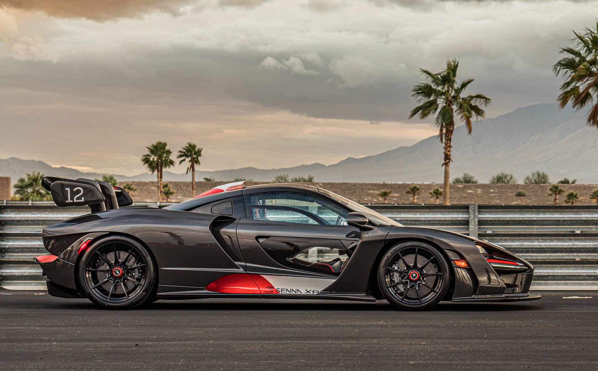 Each car gets a name and celebrates a Formula 1 race track where Ayrton Senna scored an especially outstanding victory. All three are dressed in gloss black carbon fiber, accented with the colors of the F1 circuit's country, and adorned with Ayrton's car number on the wing endplates.