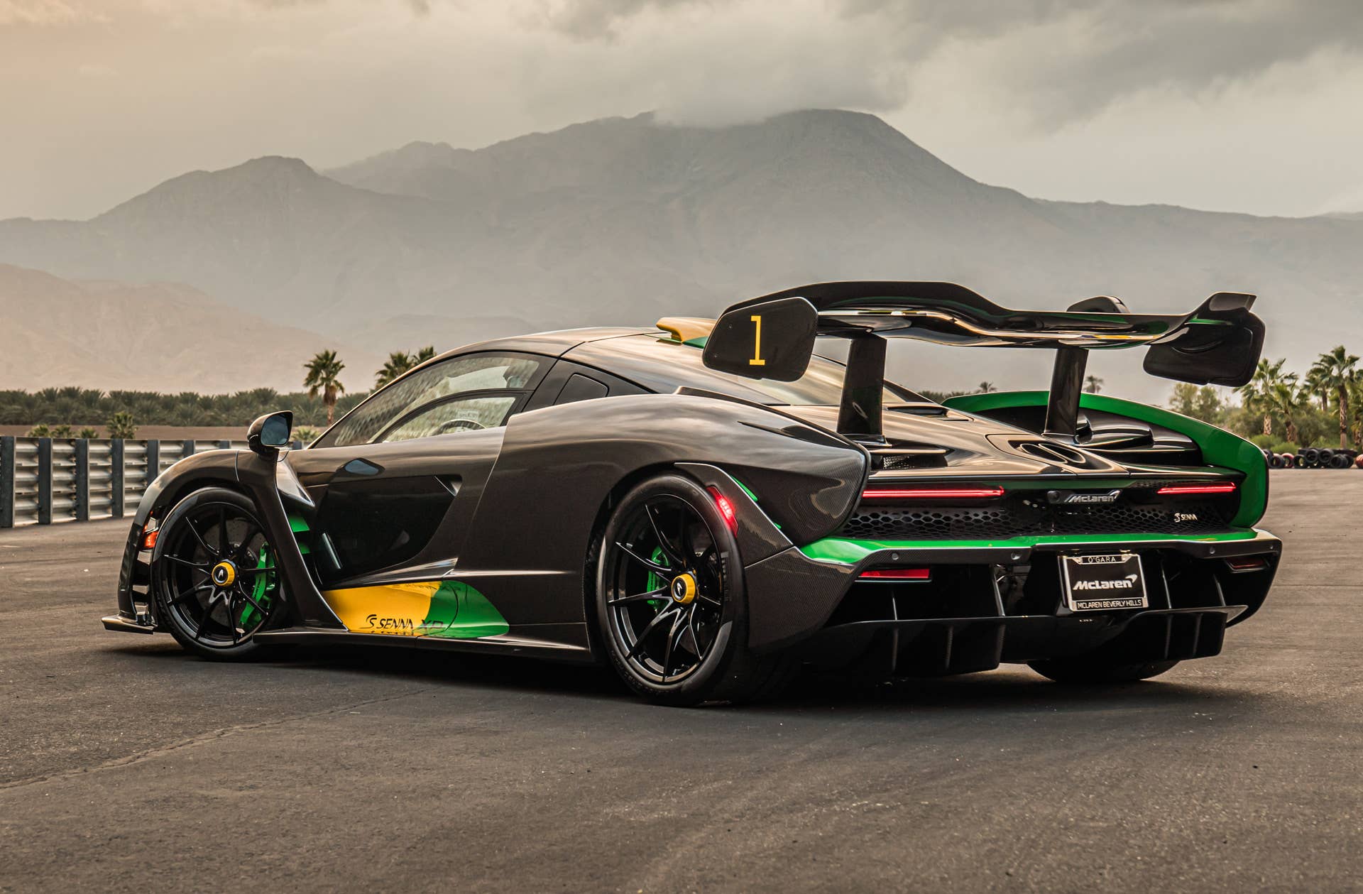 Each car gets a name and celebrates a Formula 1 race track where Ayrton Senna scored an especially outstanding victory. All three are dressed in gloss black carbon fiber, accented with the colors of the F1 circuit's country, and adorned with Ayrton's car number on the wing endplates.