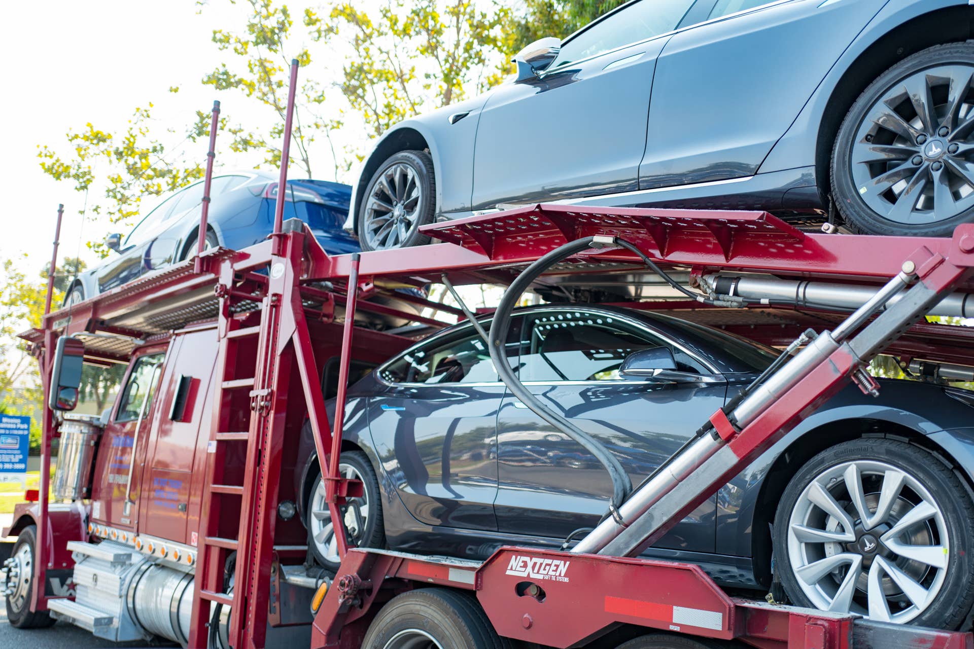 Brand new Tesla motors electric cars, including the Tesla Model 3 on a car carrier truck awaiting delivery near the company's headquarters and factory in the Silicon Valley, Fremont, California, July 28, 2018. (Photo by Smith Collection/Gado/Getty Images)