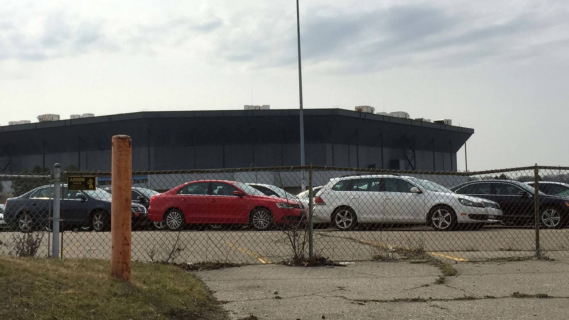 Two men have been charged with conspiring to steal diesel Volkswagen and Audi vehicles stored in the parking lot of the old Pontiac SIlverdome.