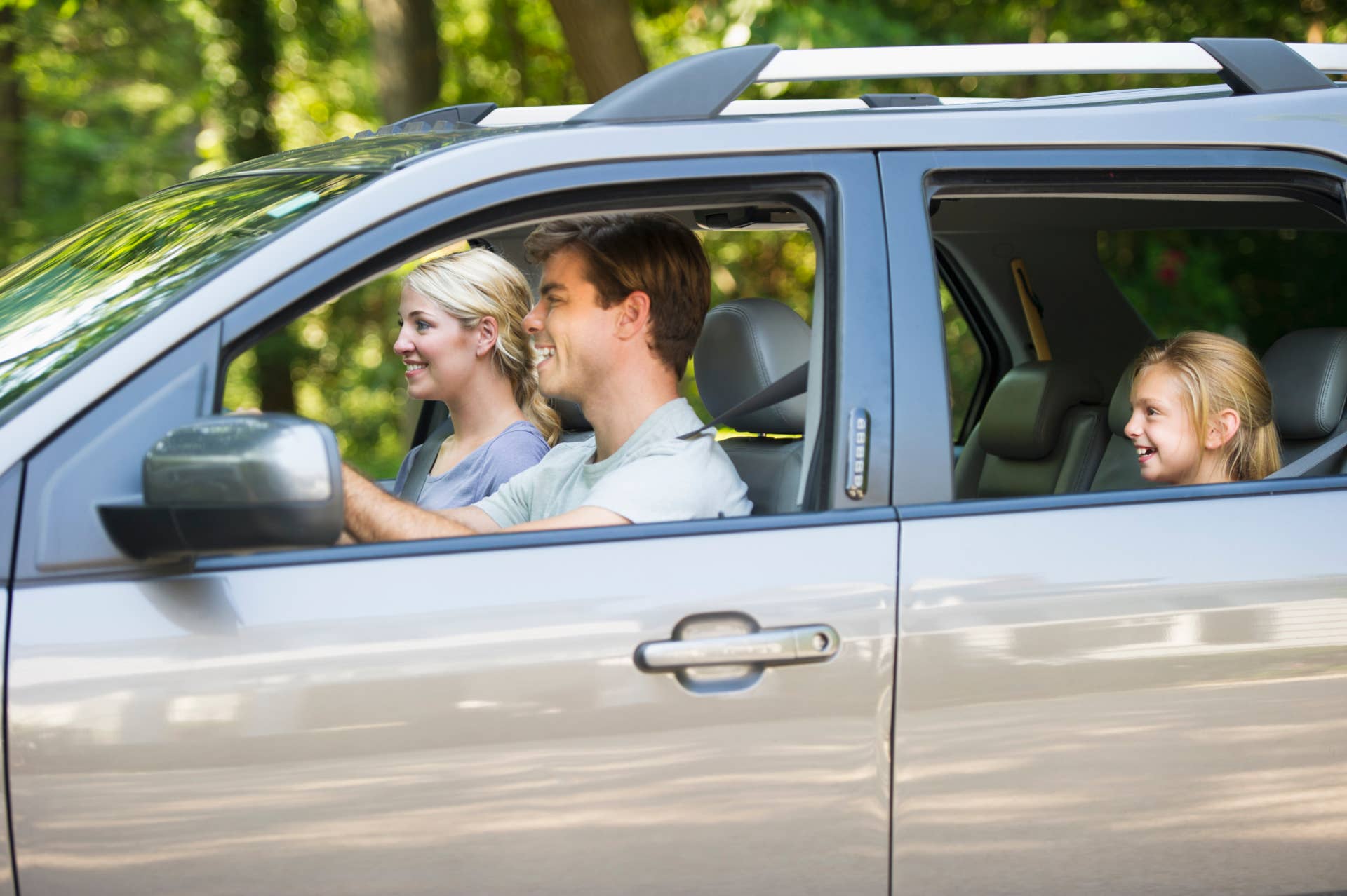 USA, New York State, Old Westbury, Parents with daughter (10-11) driving car