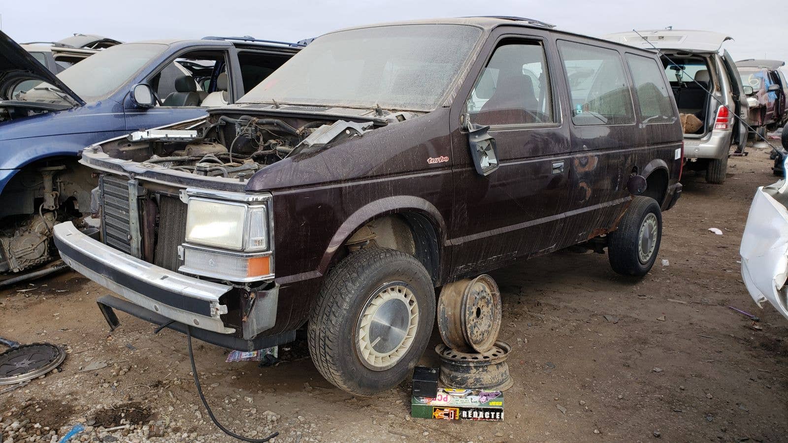 1990 Plymouth Voyager turbocharged minivan in Denver junkyard