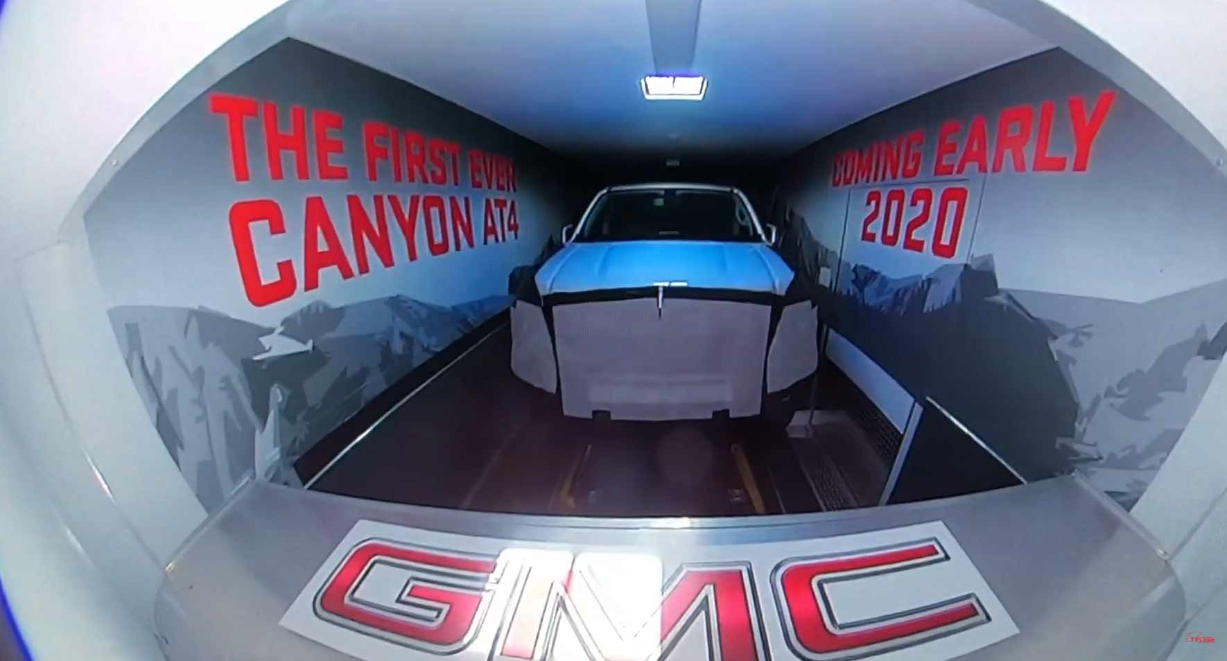GMC teases the rugged Canyon AT4 pickup at a press event for the Sierra HD.