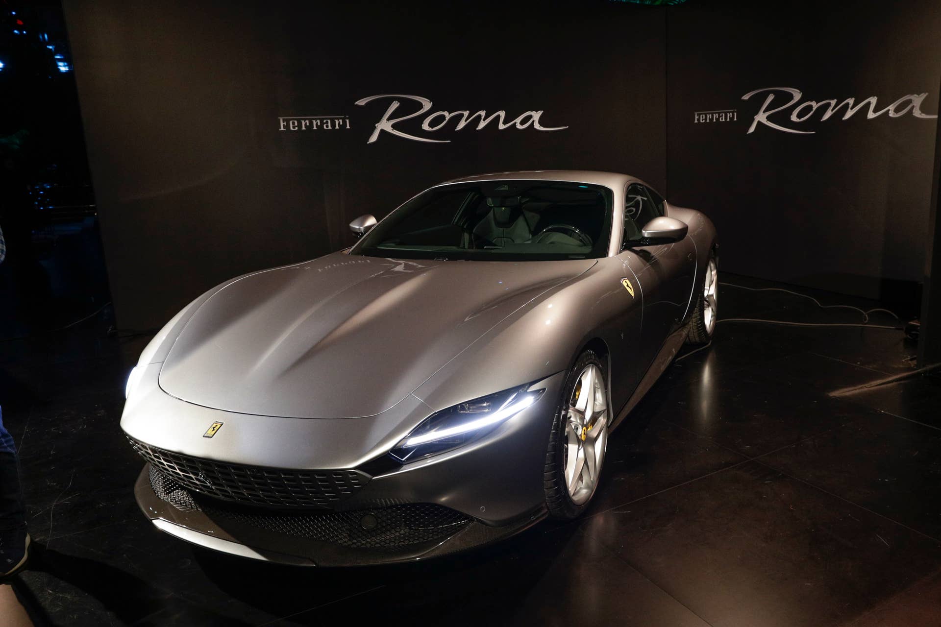 The Ferrari Roma car is unveiled in Rome, Thursday, Nov. 14, 2019. Ferrari unveils a new sports coupe aimed at enticing entry-level buyers and competing with the Porsche 911, part of a complete refresh of its model lineup by 2022. (AP Photo/Gregorio Borgia)