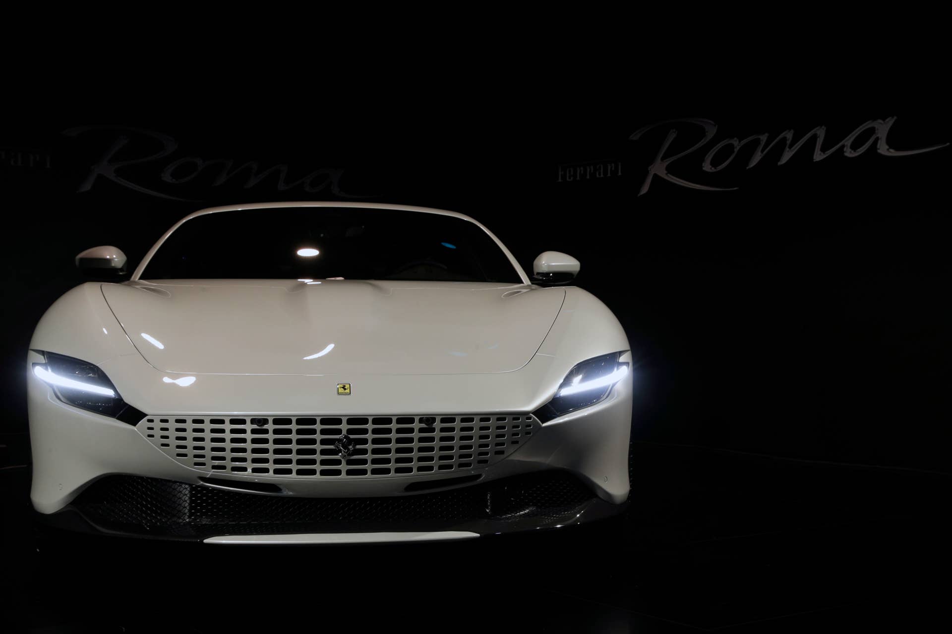 The Ferrari Roma car is unveiled in Rome, Thursday, Nov. 14, 2019. Ferrari unveils a new sports coupe aimed at enticing entry-level buyers and competing with the Porsche 911, part of a complete refresh of its model lineup by 2022. (AP Photo/Gregorio Borgia)