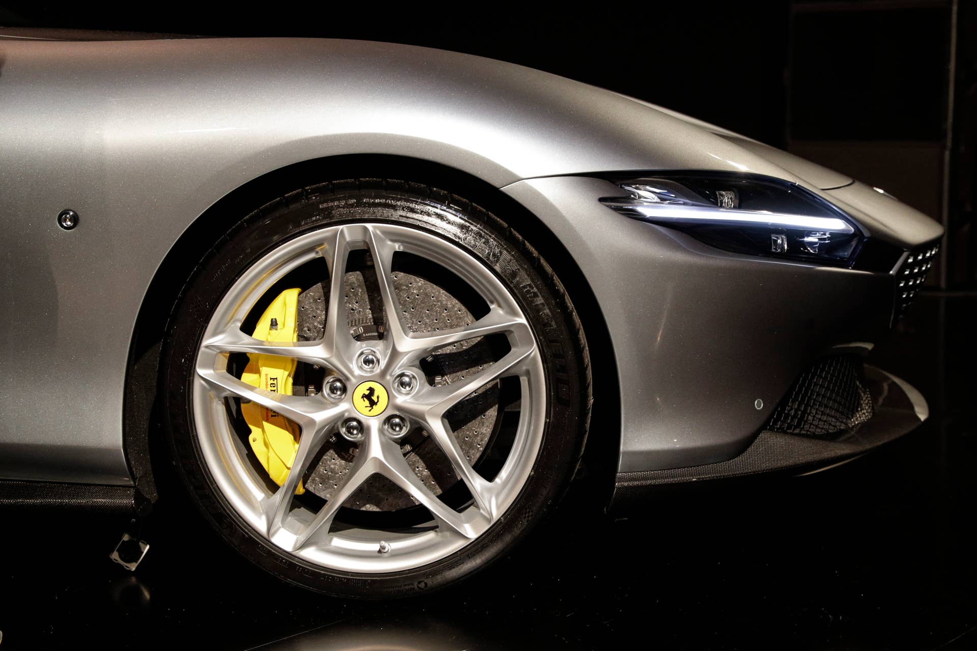 The Ferrari Roma car is unveiled in Rome, Thursday, Nov. 14, 2019. Ferrari unveils a new sports coupe aimed at enticing entry-level buyers and competing with the Porsche 911, part of a complete refresh of its model lineup by 2022. (AP Photo/Gregorio Borgia)