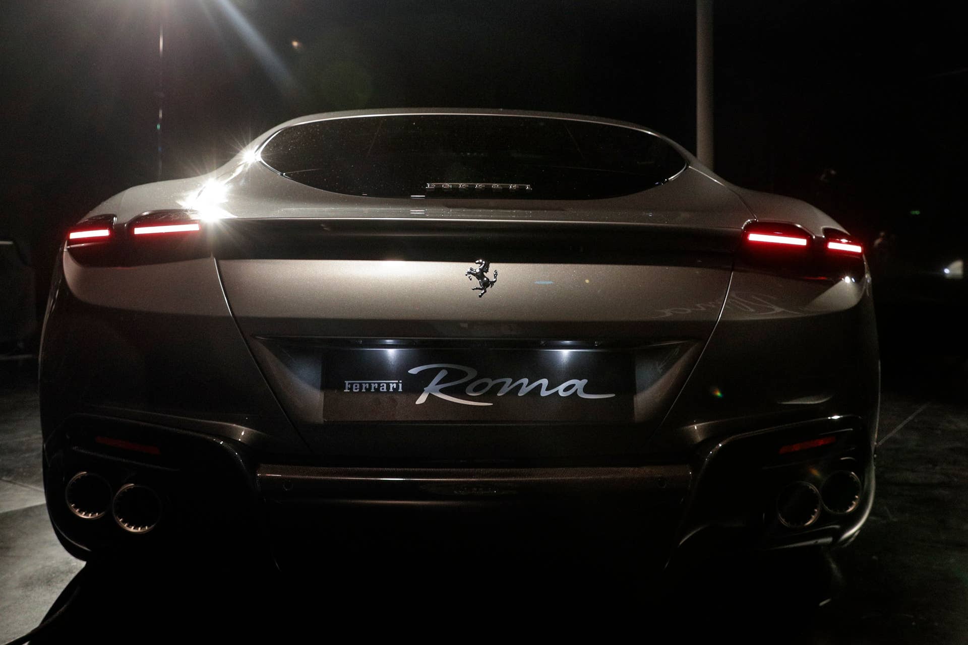 The Ferrari Roma car is unveiled in Rome, Thursday, Nov. 14, 2019. Ferrari unveils a new sports coupe aimed at enticing entry-level buyers and competing with the Porsche 911, part of a complete refresh of its model lineup by 2022. (AP Photo/Gregorio Borgia)