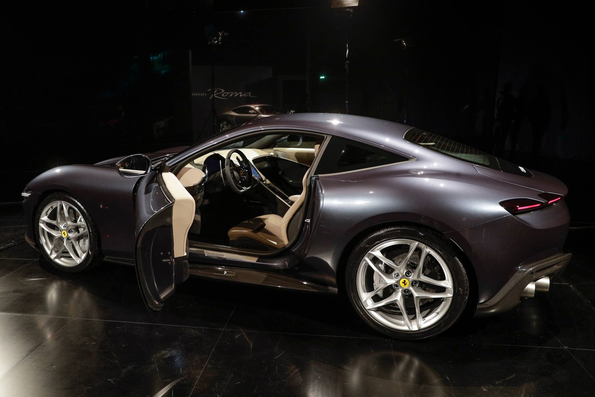 The Ferrari Roma car is unveiled in Rome, Thursday, Nov. 14, 2019, 2019. Ferrari unveils a new sports coupe aimed at enticing entry-level buyers and competing with the Porsche 911, part of a complete refresh of its model lineup by 2022. (AP Photo/Gregorio Borgia)